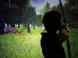 Virtual archery with tangible interaction