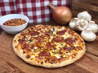 The History of Pizza: From Italy to Your Table at Manny and Olga
