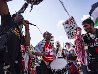 Thousands gather in Union Park on first day of DNC to demand...
