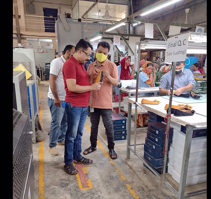 "At Final Q.C station - checking every pair before shipment....