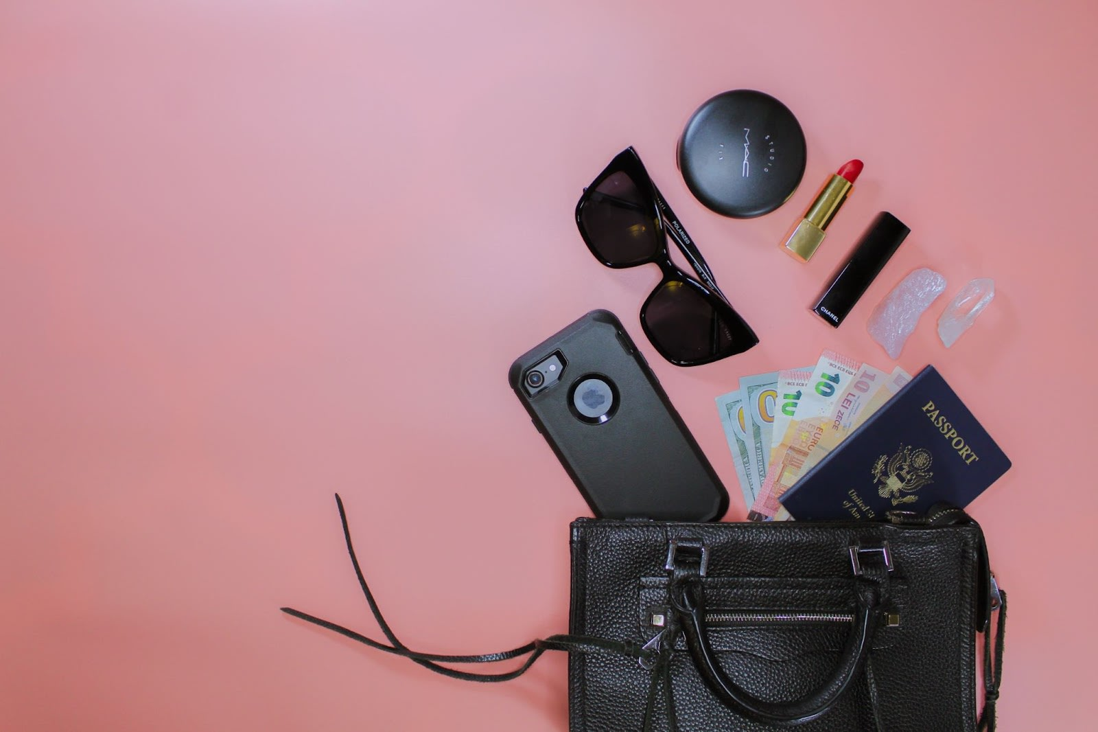 Alt text: Flat lay of a handbag, makeup and similar items. Image source: 