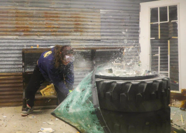 A Waco Rage Room player smashes a windshield. Chase (Junyan) Li | Photographer