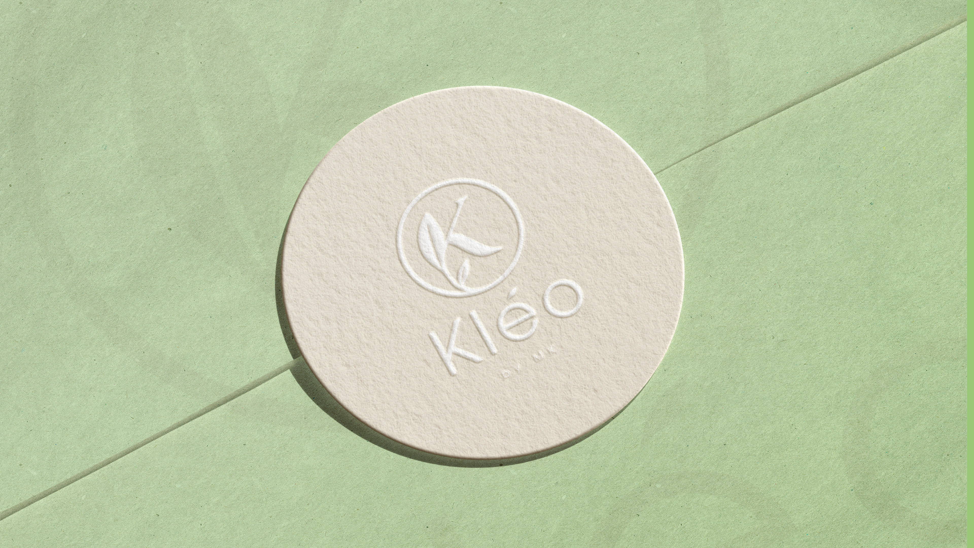 A sleek logo presentation showcasing the versatility of Kleo’s brand mark