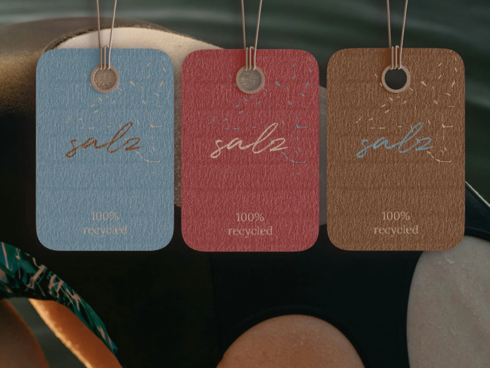 Clothing tag variations that highlight both design detail and the brand’s eco-friendliness.