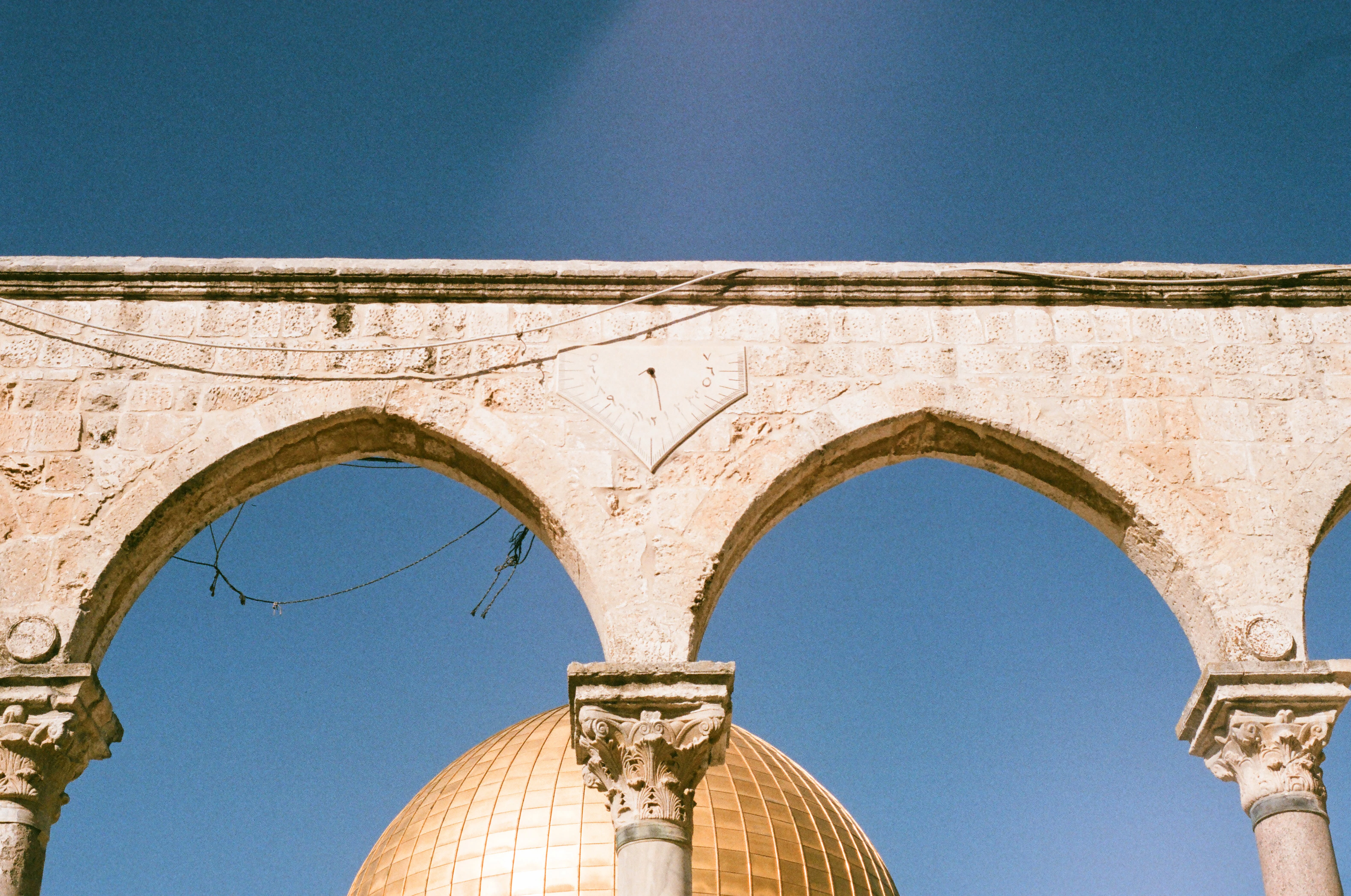 What may captivate you in this photo is the Dome on the Rock (Qubbat as-Sukhra'). What should captivate you, however, is the sundial, pointing to about 12:45pm, just before the area was closed for prayer.