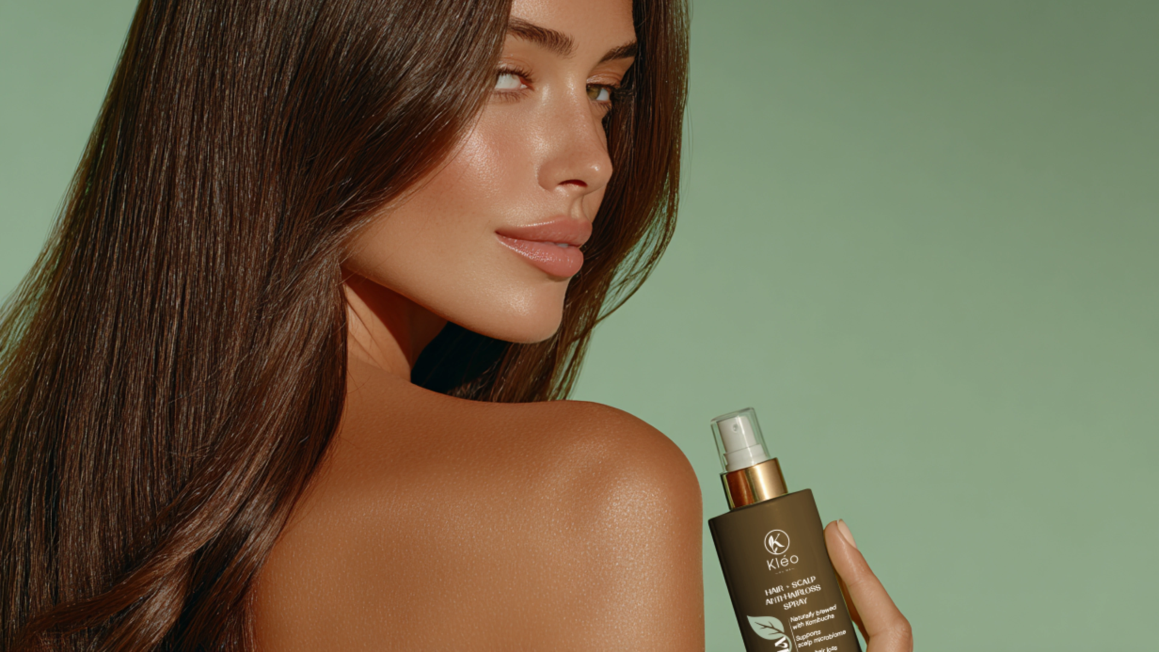 Lifestyle shot featuring a natural woman holding Kleo’s product, emphasizing authenticity and everyday elegance.