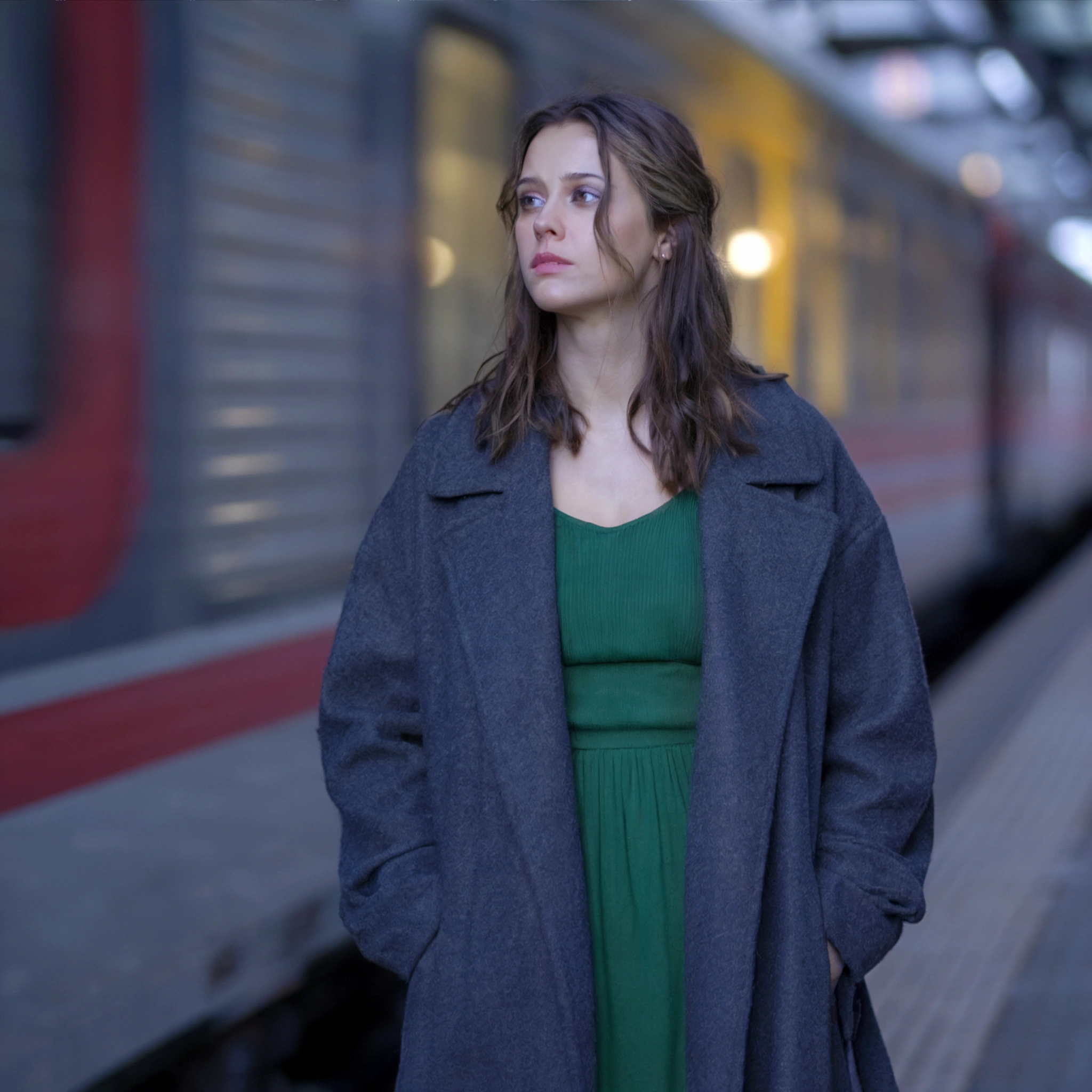 Woman at a Train Station