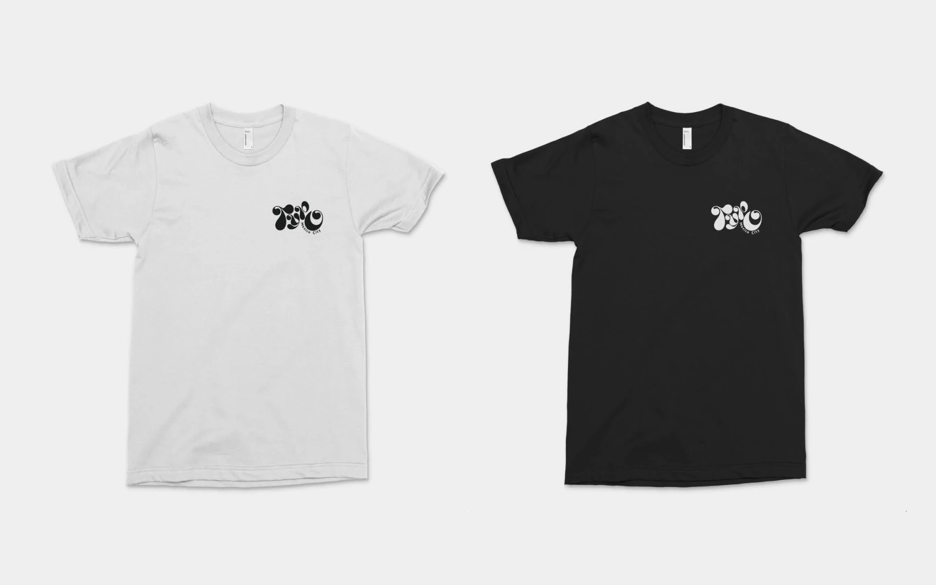White t-shirts for conference attendees, black t-shirts for event staff.