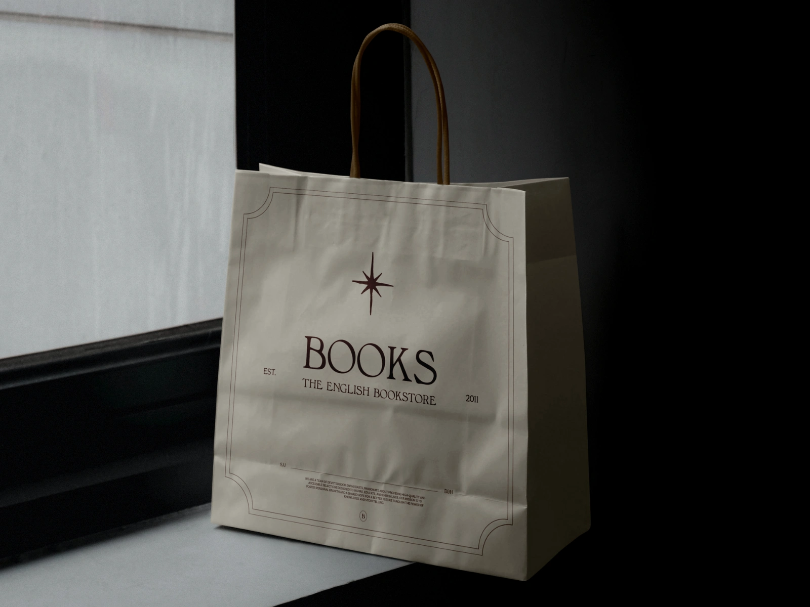 Design for the paper bag featuring the store’s logo, a custom hand-drawn sparkle illustration and additional visual elements that round out the overall aesthetic. These include a bespoke decorative border, location details of the physical store and a brief vision & mission statement placed near the bottom of the bag.
