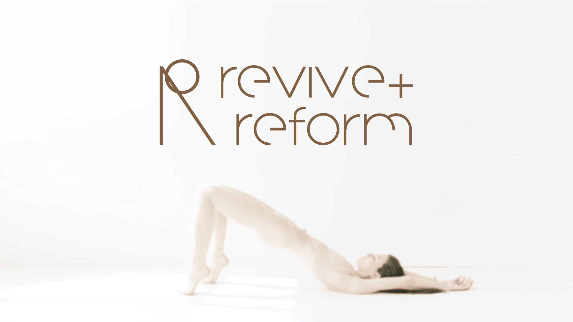 The logo serves as the visual cornerstone, embodying the harmony between diverse training forms offered at Revive+Reform. A right angle intersects with a circle above, artfully symbolizing a yoga pose, capturing the essence of balance, strength, and fluidity. The geometric precision exudes a sense of order and purpose, while the circular element adds a touch of continuity and unity, emphasizing the interconnectedness of mind and body in the pursuit of wellness.