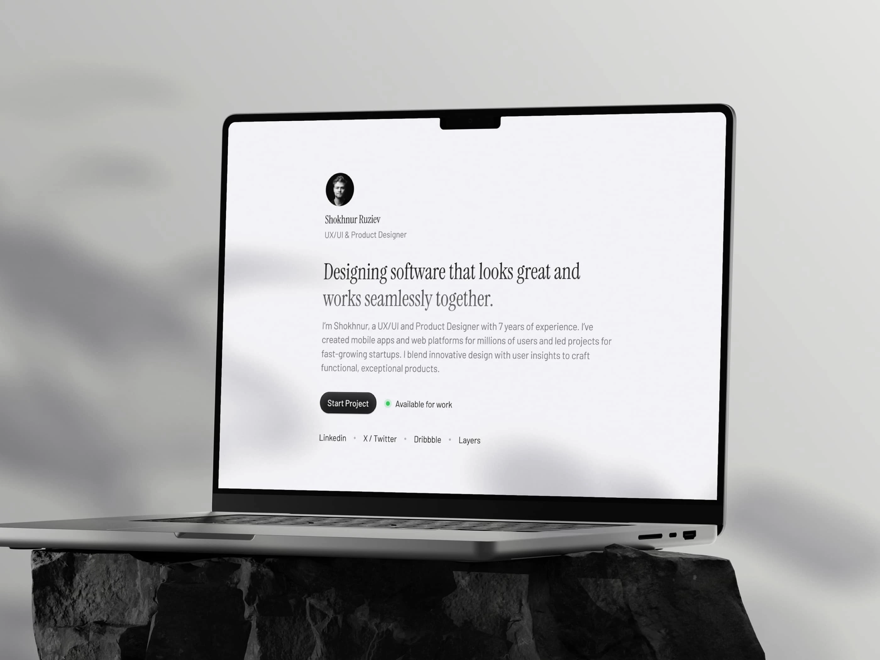 Home page displayed on a MacBook mockup.