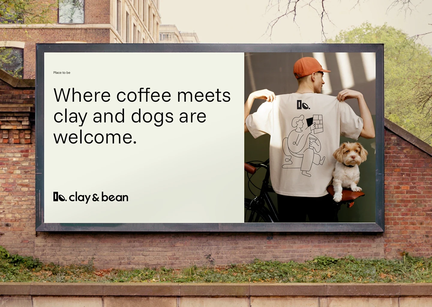 Clay & Bean billboard with text ‘Where coffee meets clay and dogs are welcome’ beside branded T-shirt
