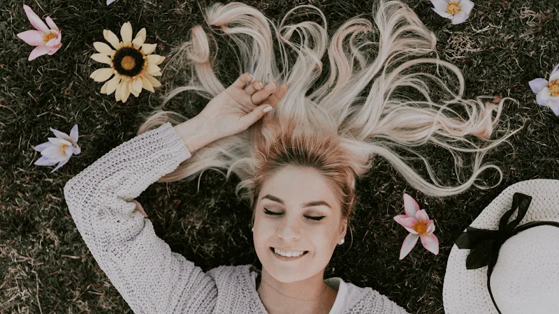 Smiling woman with nicely bleached hair.