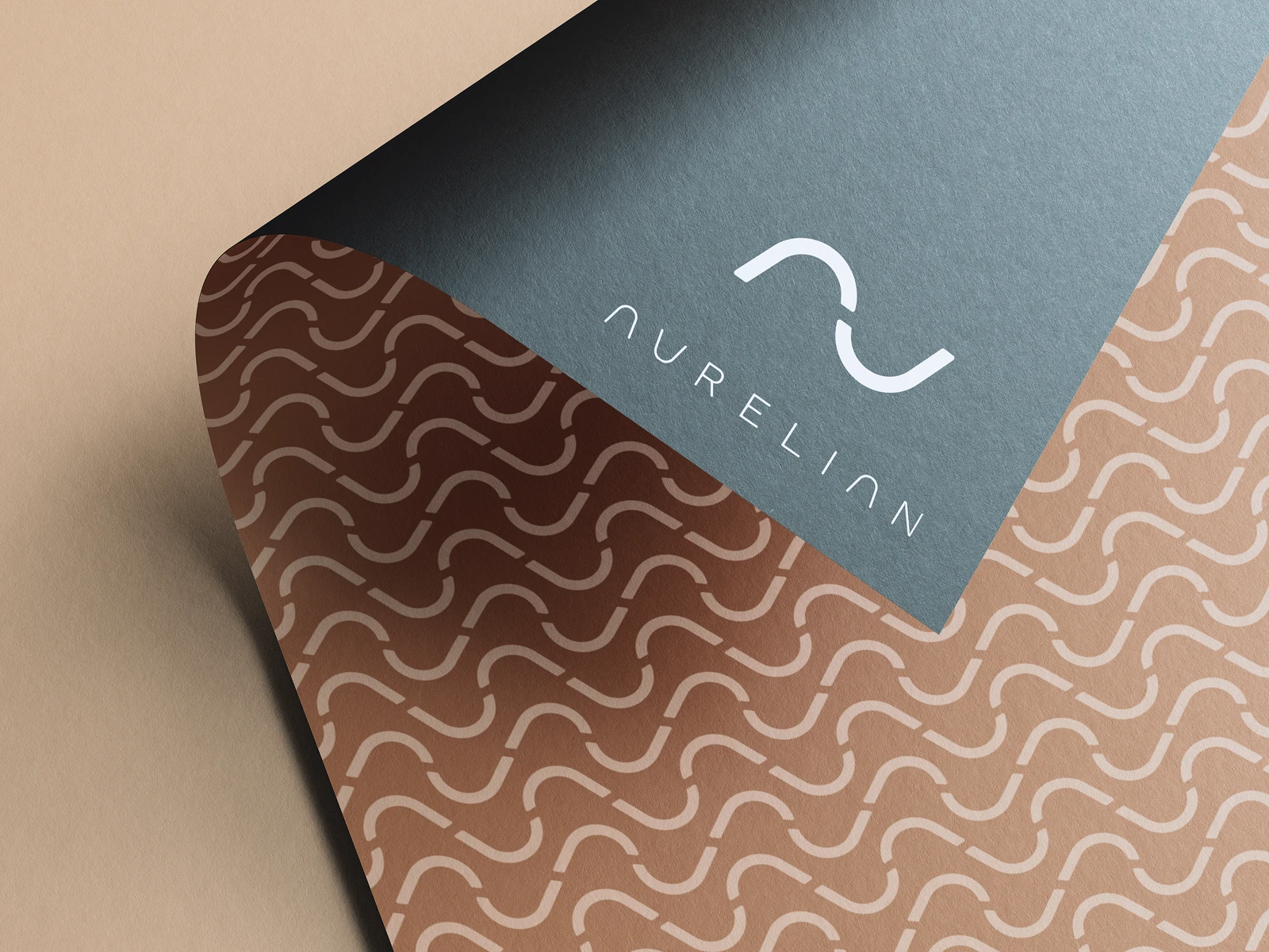 Custom pattern system derived from the monogram — used across brand packaging, print, and web collateral.