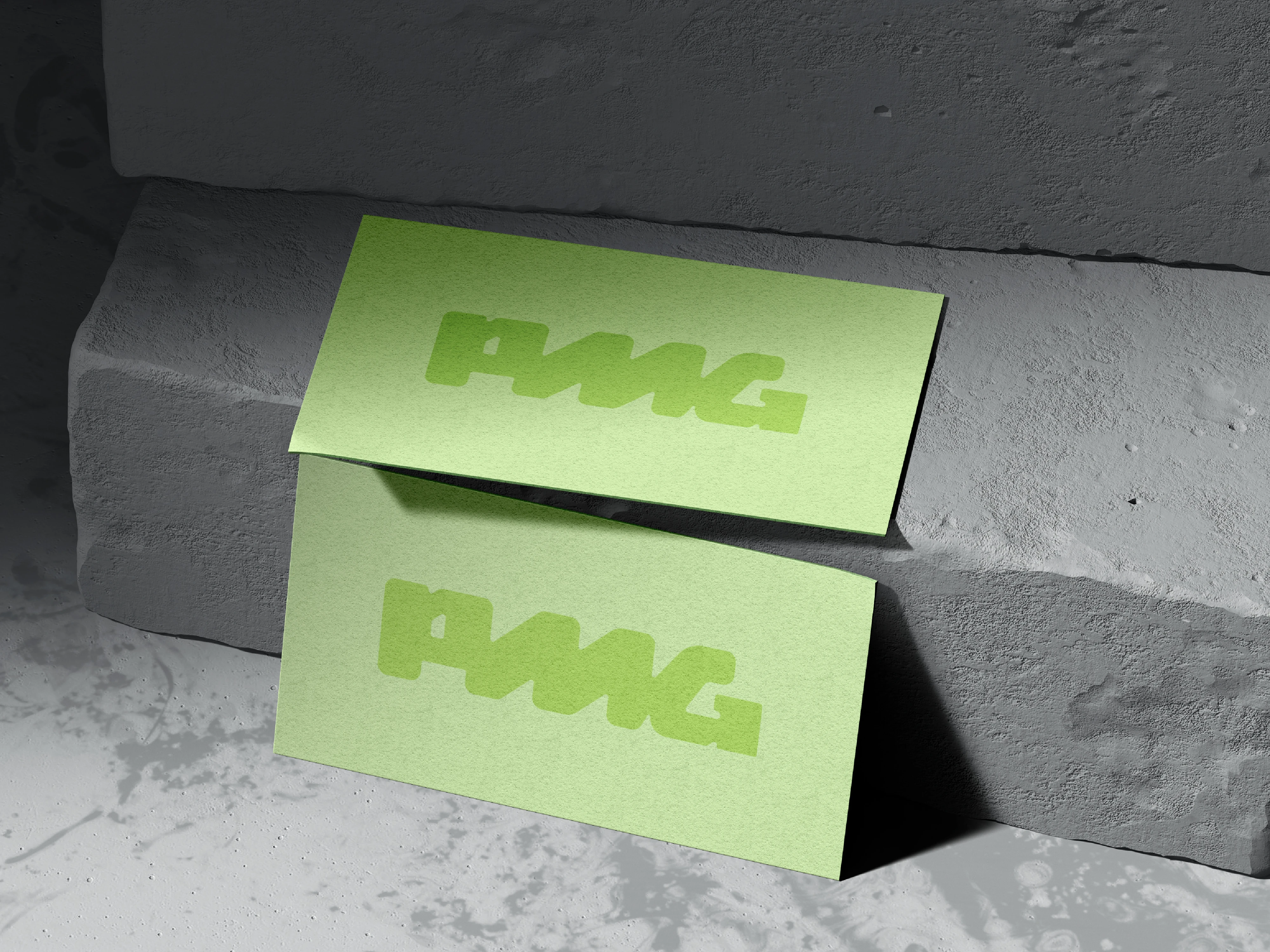 New PMG logo on business cards on new color palette