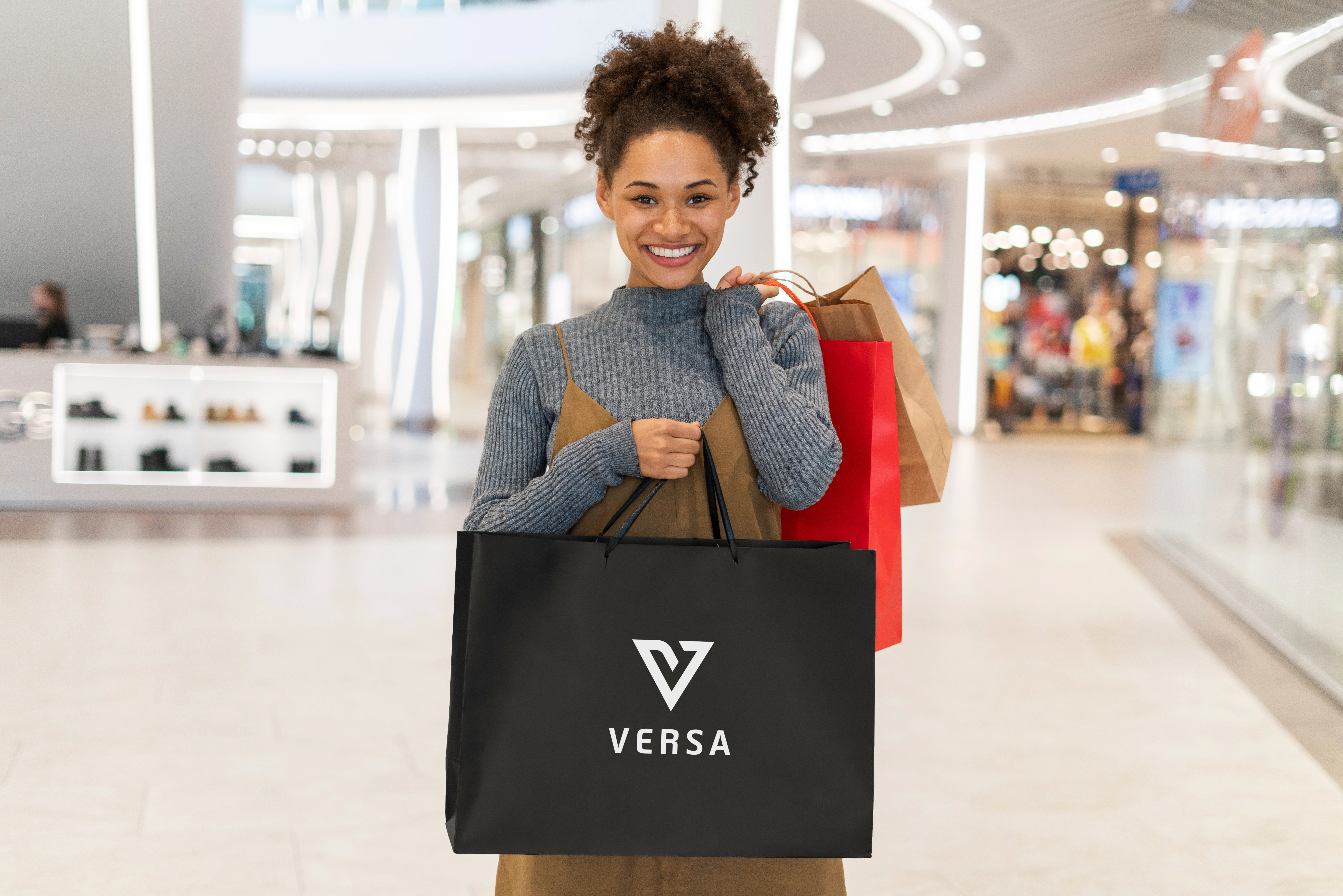 This placement connects the brand to the customer's lifestyle. It shows how VERSA apparel is an integral part of a modern, stylish wardrobe, making the brand feel aspirational and relatable within a real-world context.
