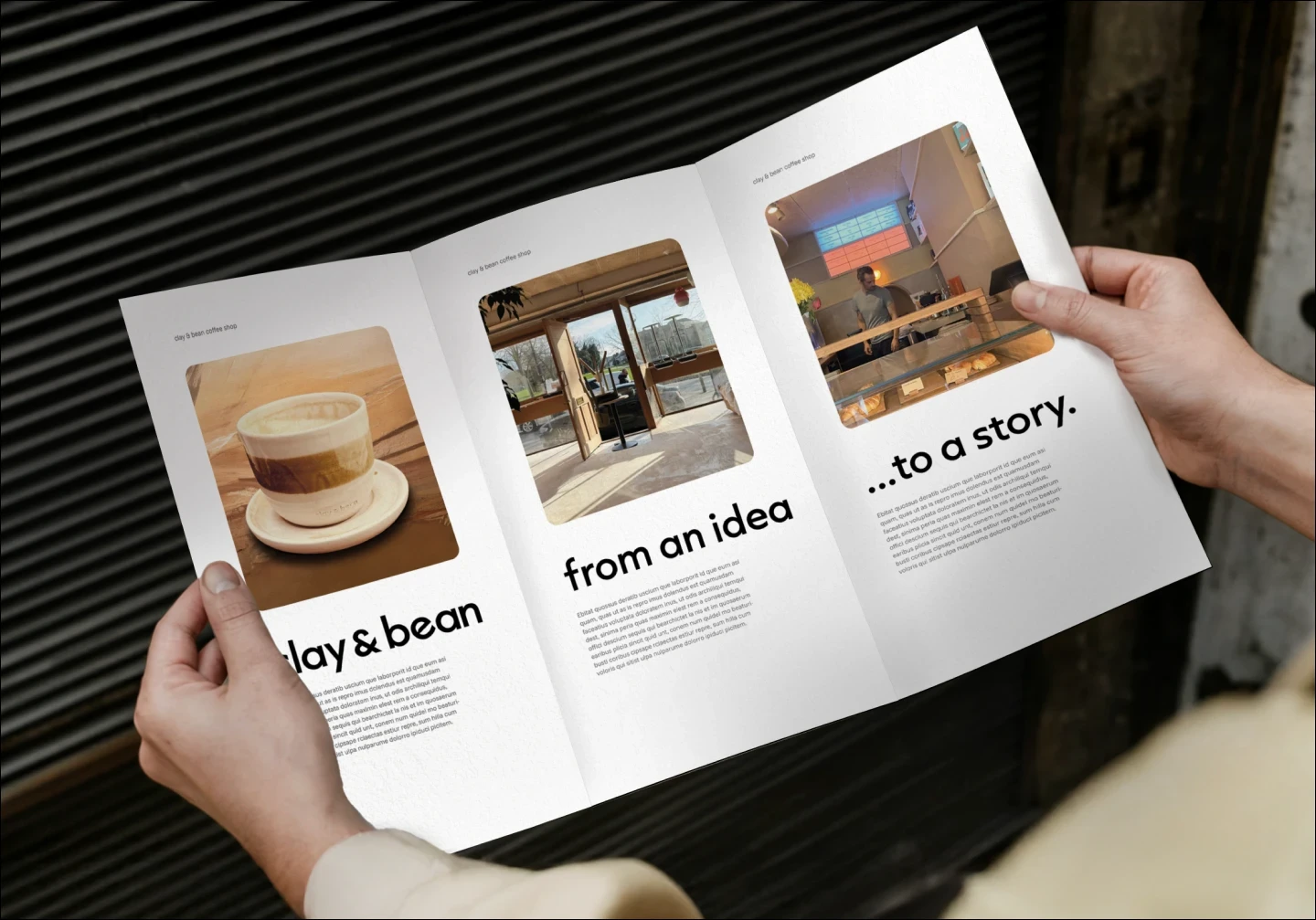 Hands holding a Clay & Bean tri-fold flyer with photos and text reading ‘from an idea… to a story