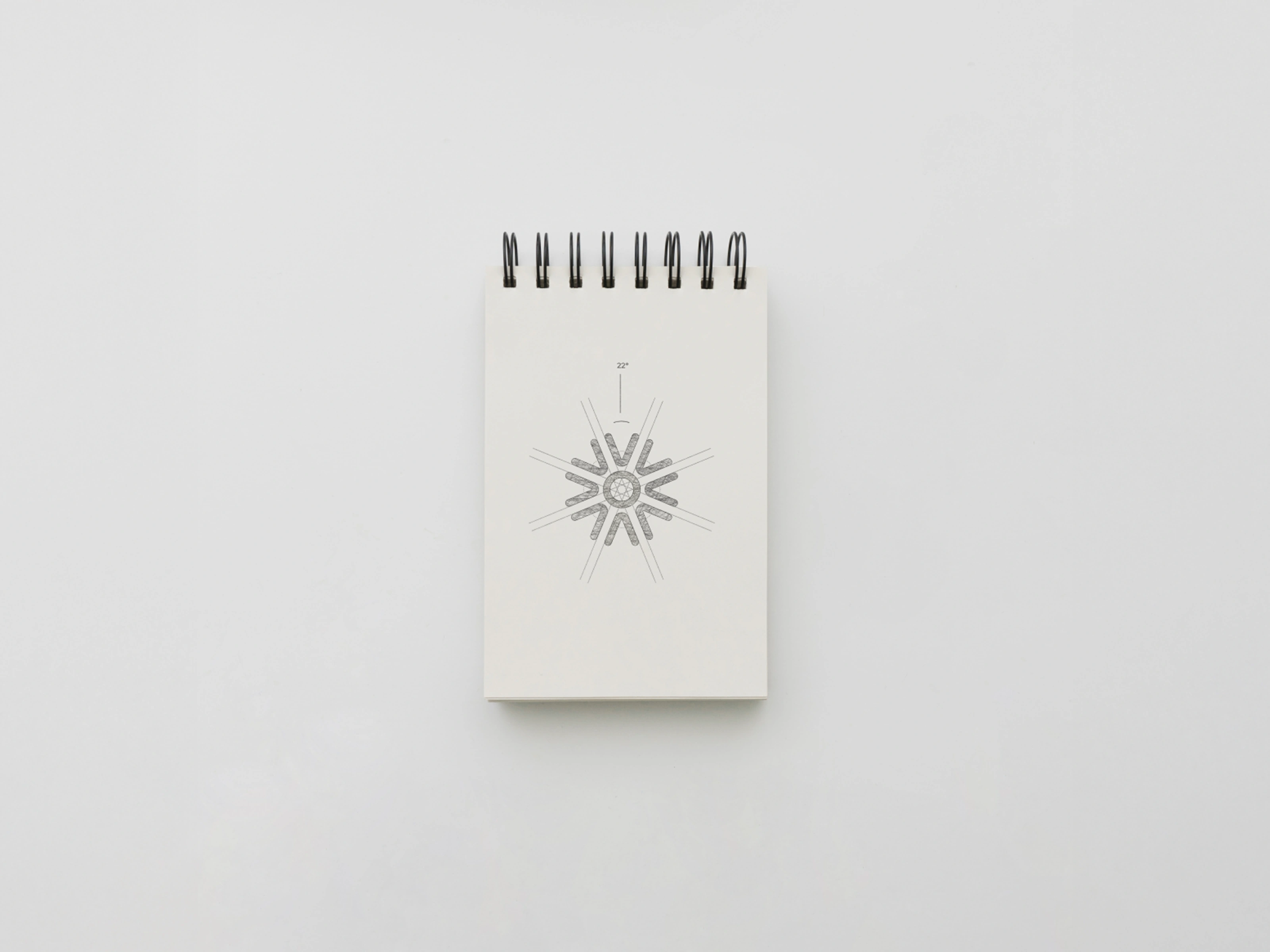 Sketch of the logo, scribbled and refined to look sharper