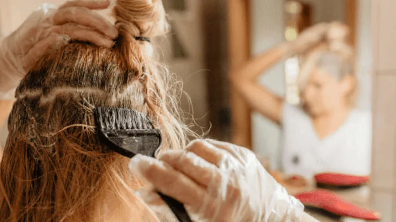 Woman bleaching her hair.