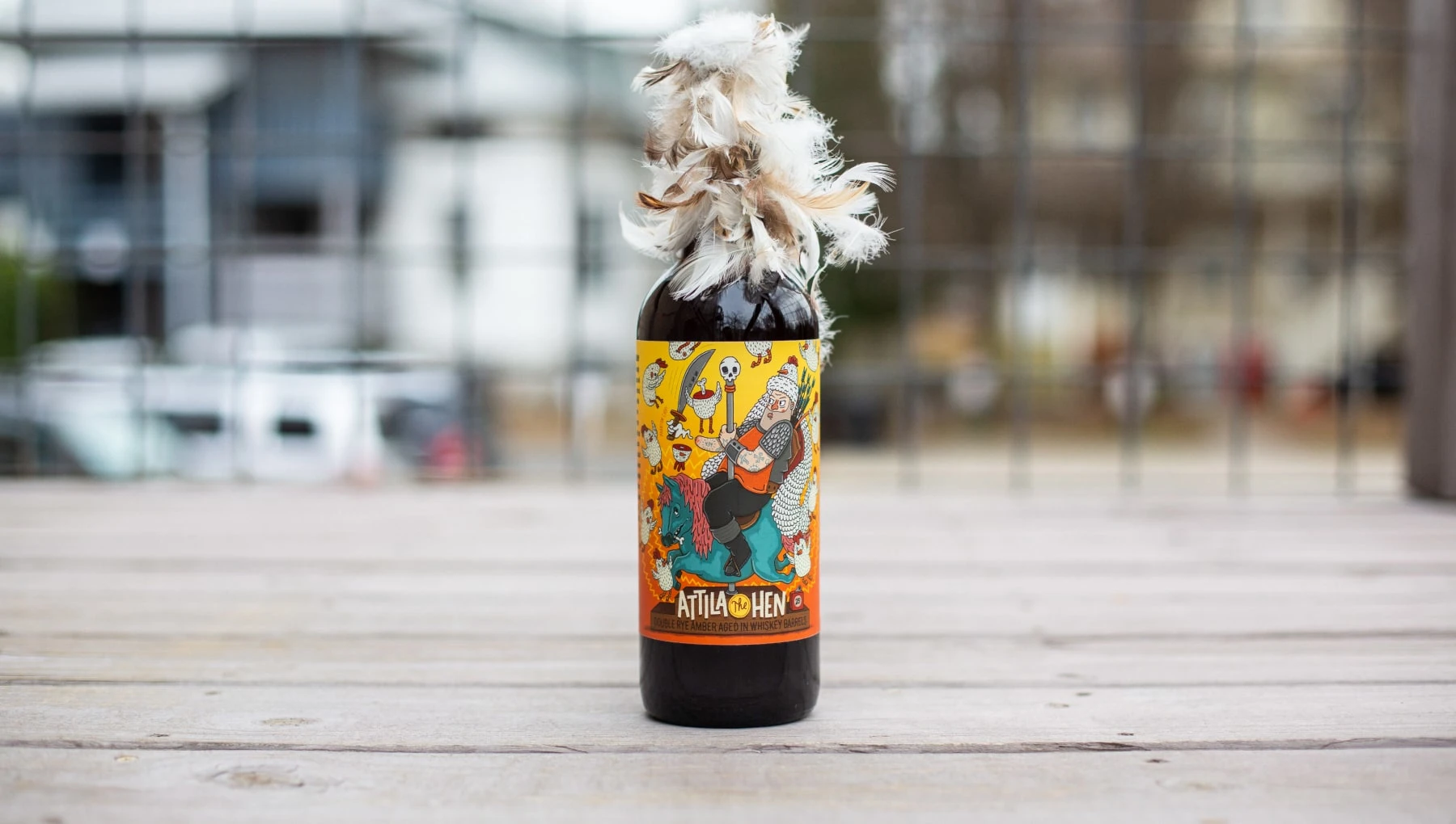 Tarred and feathered "Attila the Hen" bottle packaging.