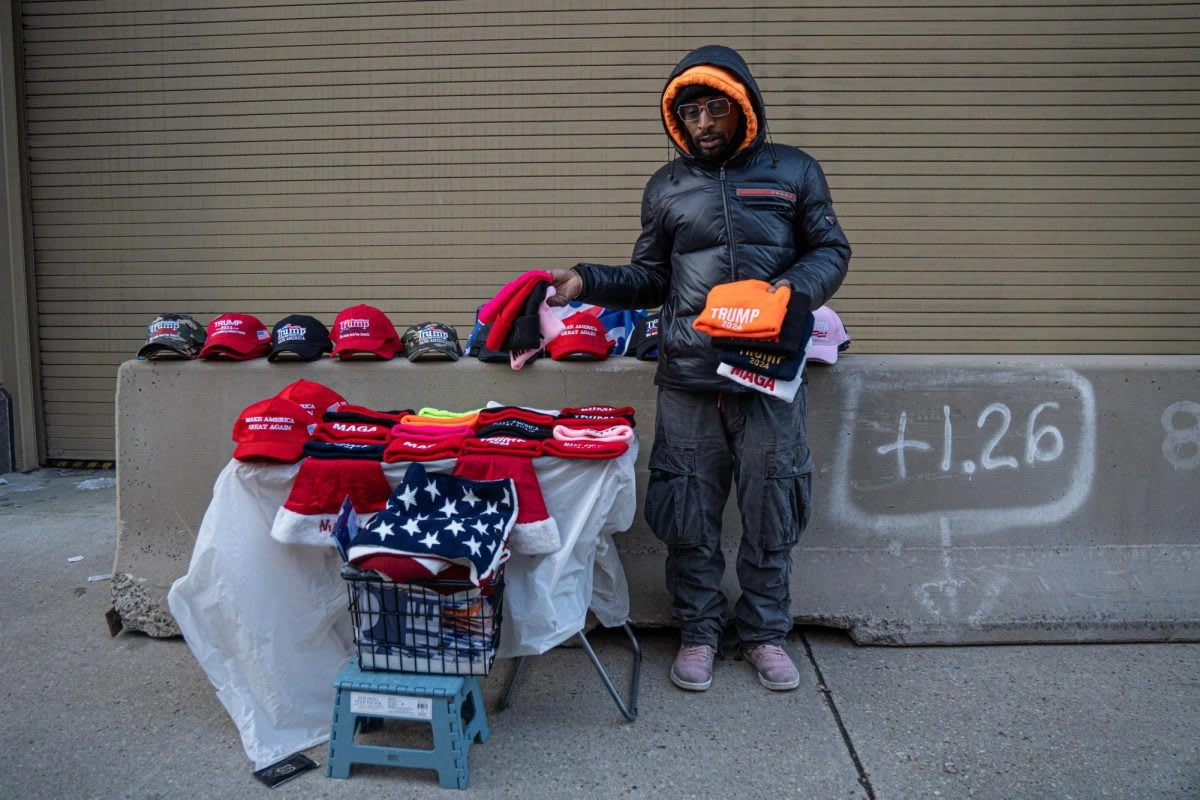 Spike Edwards, from New York City, sells MAGA gear outside of the Capital One Arena in Washington D.C. as people file in for an inauguration watch party on Monday, Jan. 20, 2025. Addison Annis
