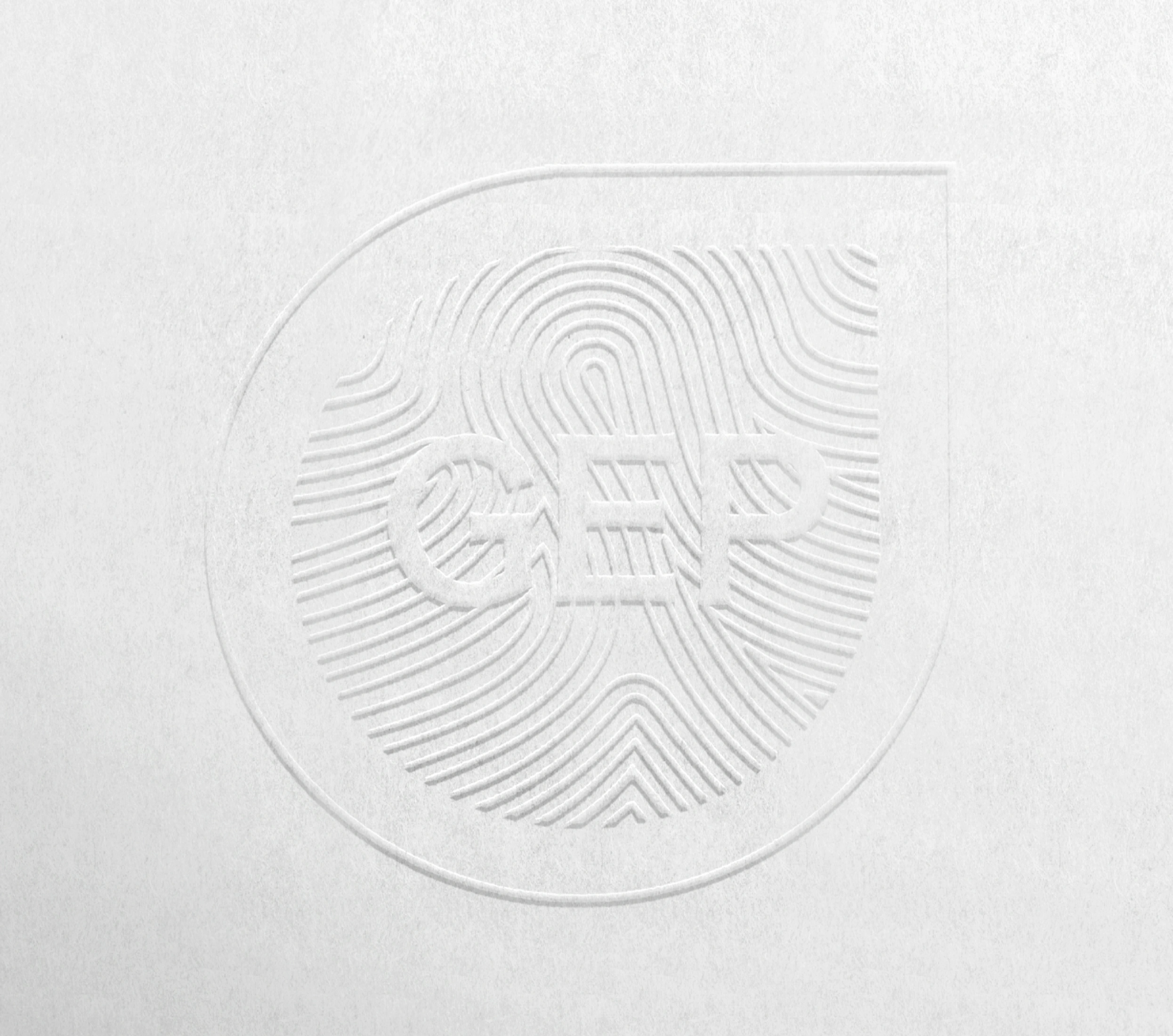 The submark is derived from the empathy symbol combined with a fingerprint to symbolize our impact 