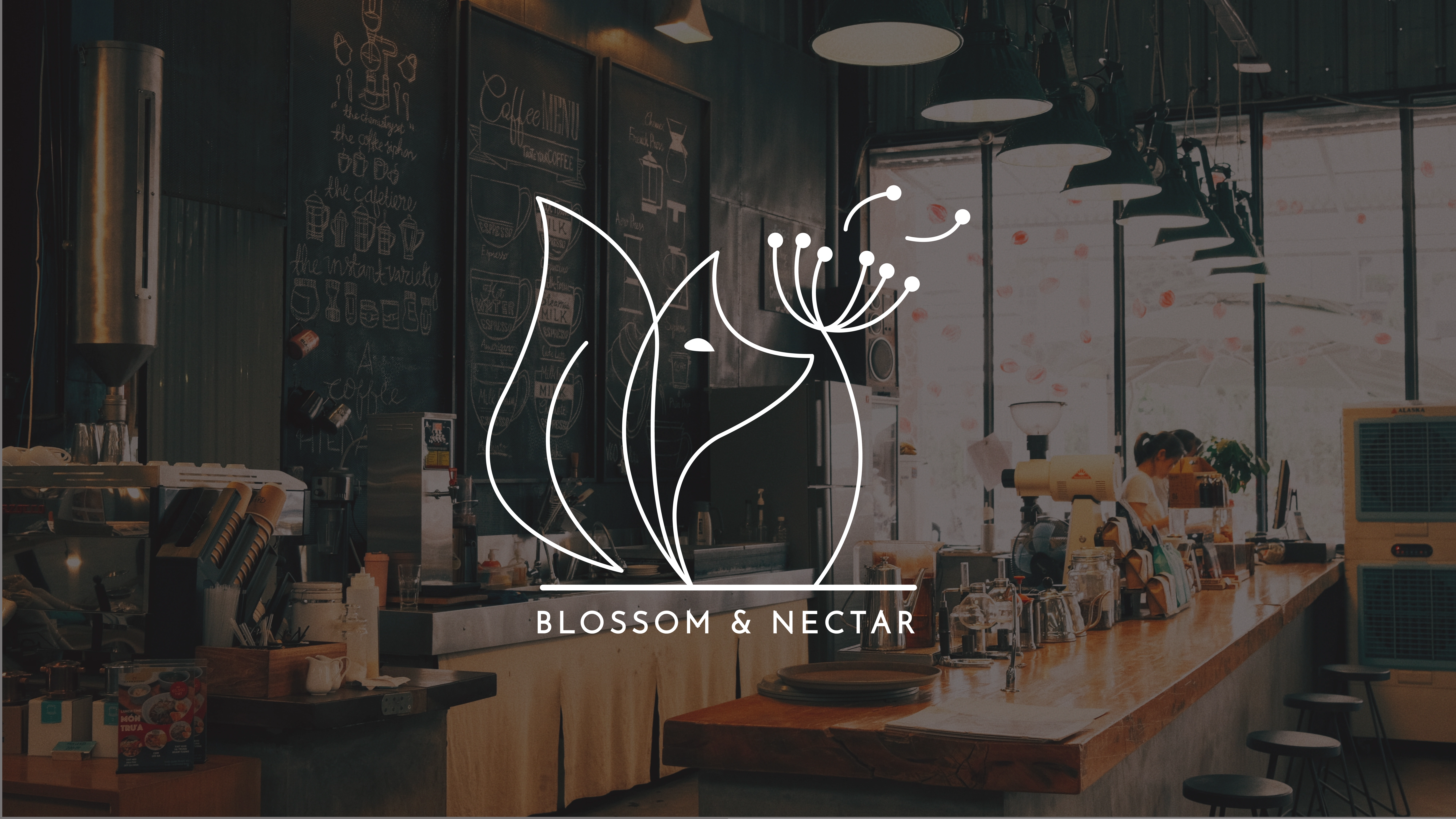 An image background of a cafe with the blossom and nectar logo on top in white