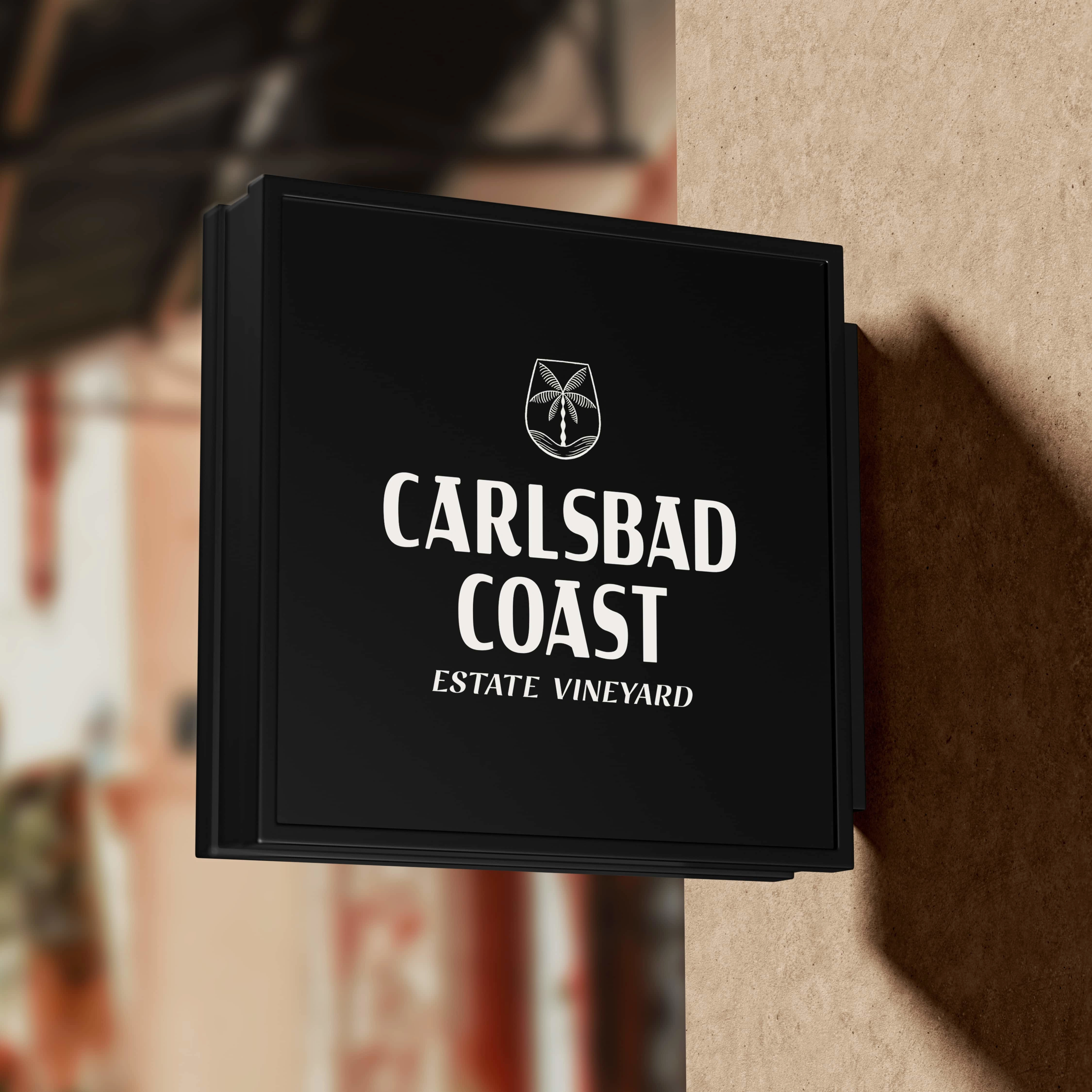 The logo is a beautiful representation of the coastal city of Carlsbad. The icon is a wine glass that merges seamlessly with the ocean and a palm tree, creating a unique and distinctive design. It evokes a sense of relaxation and positivity, perfectly capturing the North County/San Diego vibe. The fonts used in the logo are eye-catching and beachy, adding to the coastal feel. 

The logo creates a unique connection and experience for both locals and visitors alike, bringing them closer to the essence of Carlsbad and its beautiful surroundings. Overall, the logo is a perfect reflection of the city’s coastal and laid-back atmosphere, making it a standout piece of design.