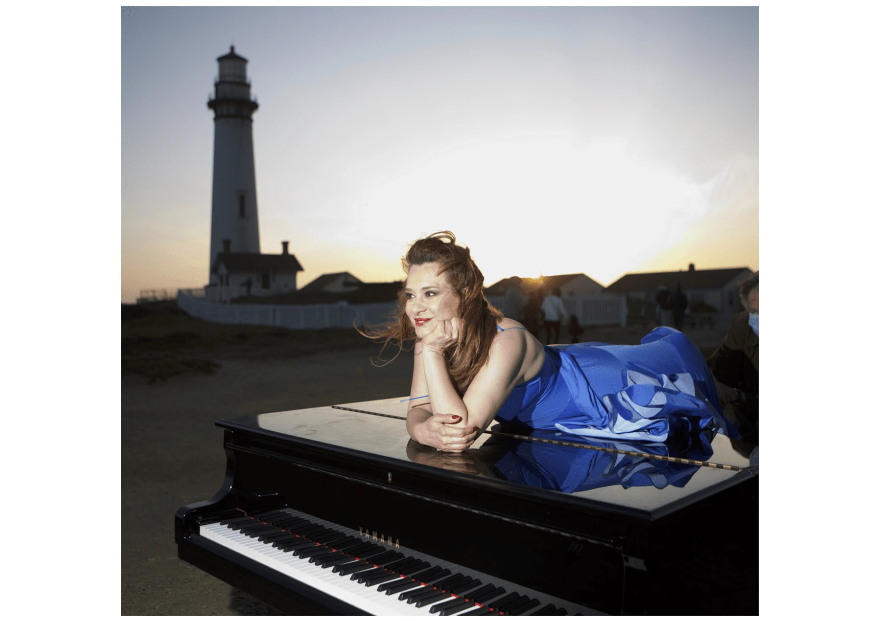 BEFORE: Faranak Shahroozi on a piano next to a lighthouse 