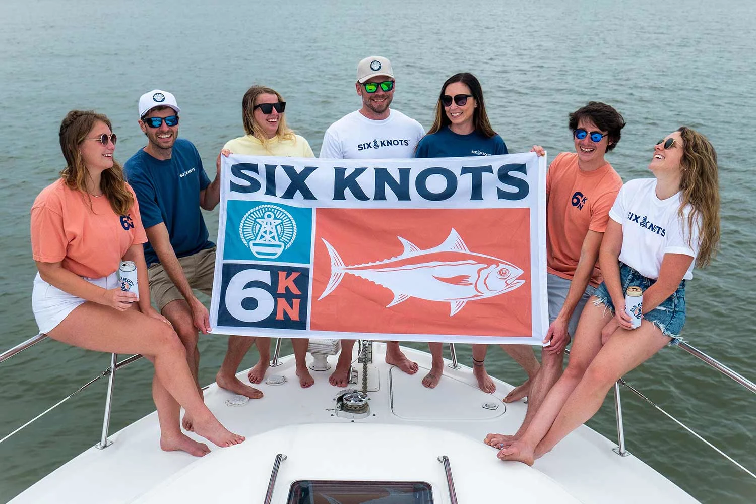 The Six Knots flag being proudly displayed at the front of a boat