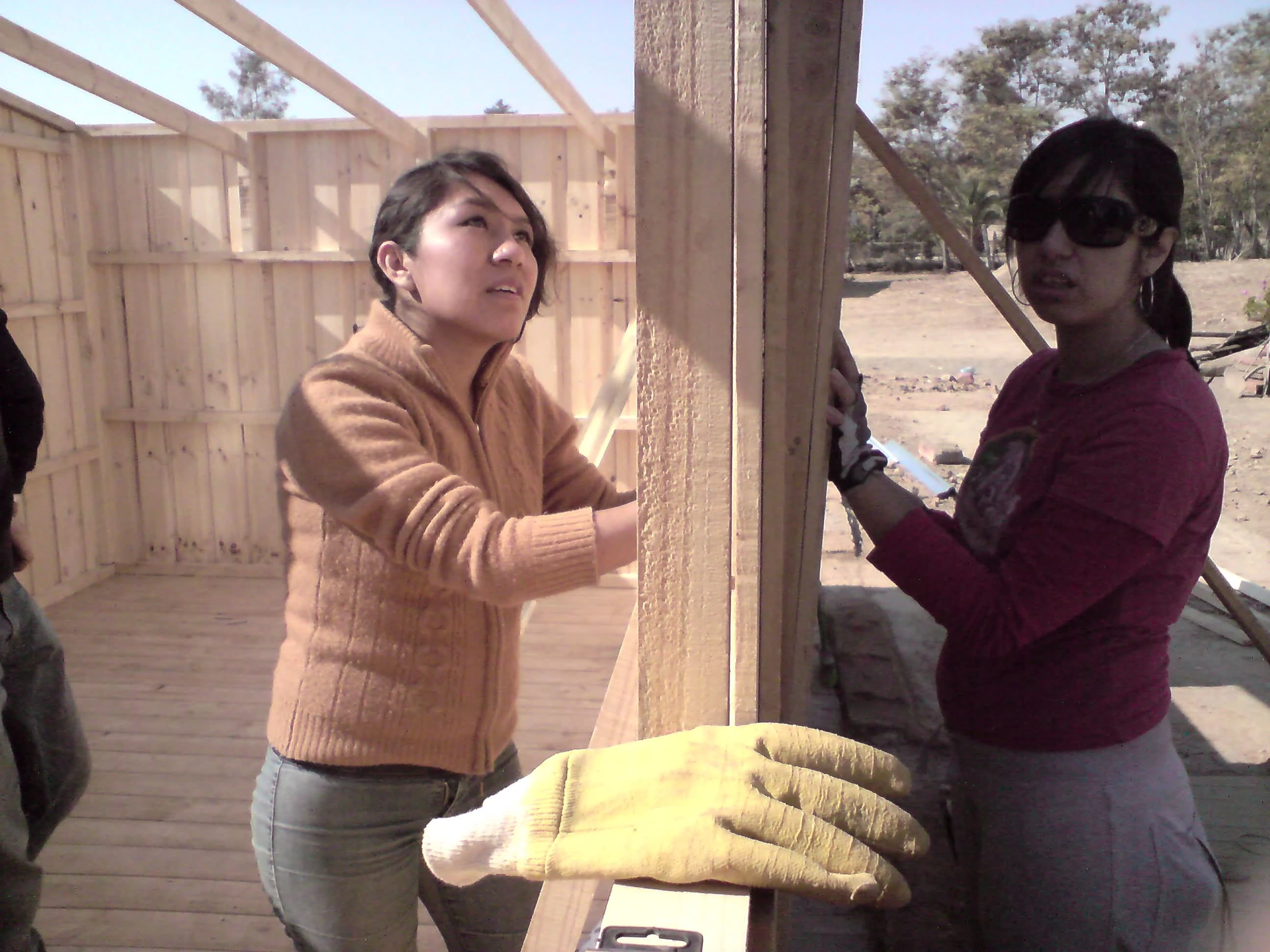 Ivana and Danila fitting in a door at Los Coipos, April 2010. Photo by Ben Angel.