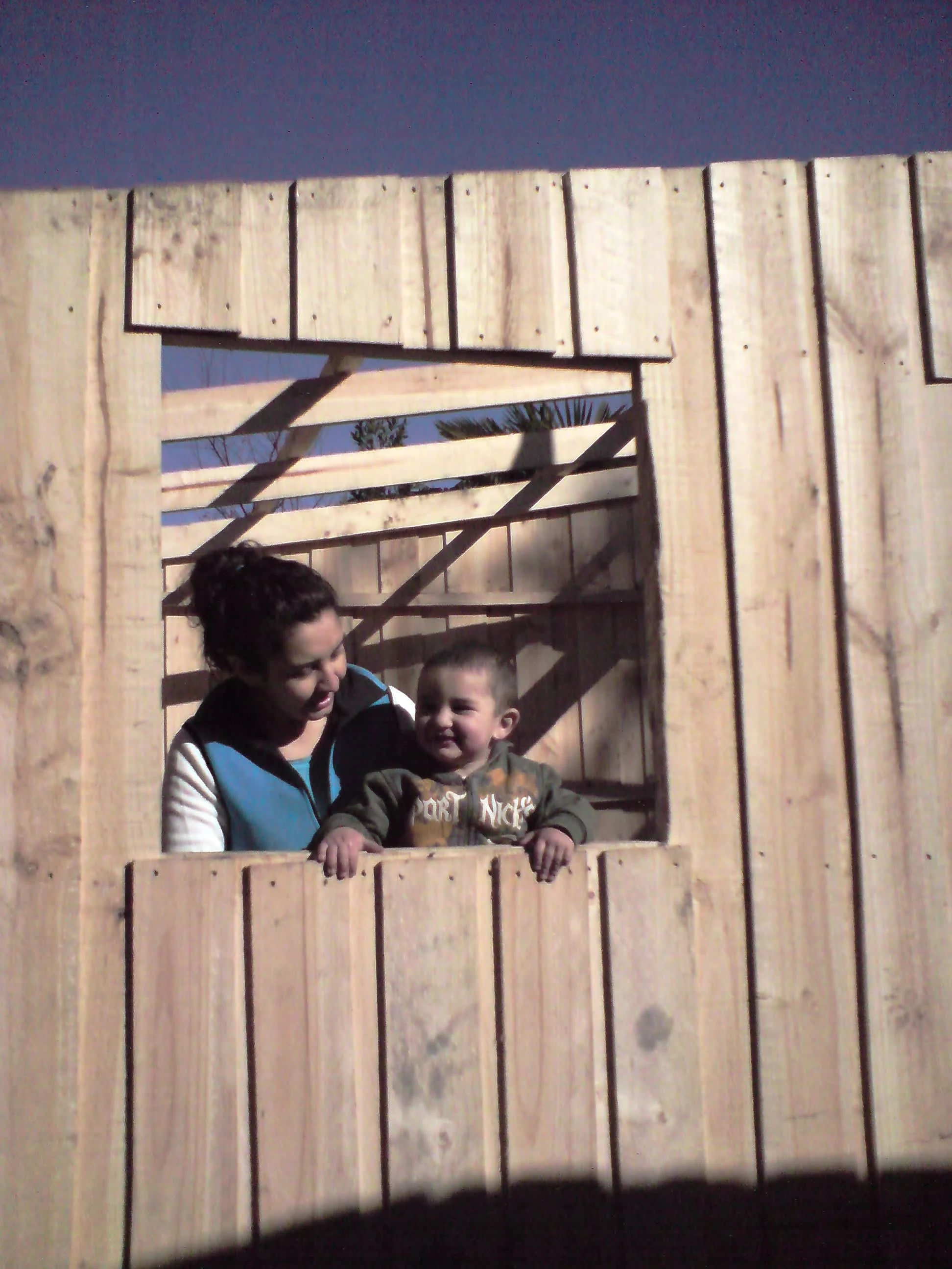 Putting a roof over Emilio and his mother Lorena in Linares, Chile, May 2010. Photo by Ben Angel.