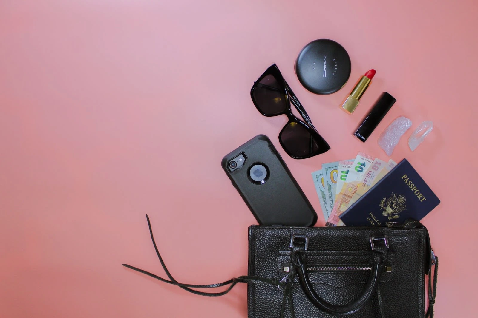 Alt text: Flat lay of a handbag, makeup and similar items. Image source: 