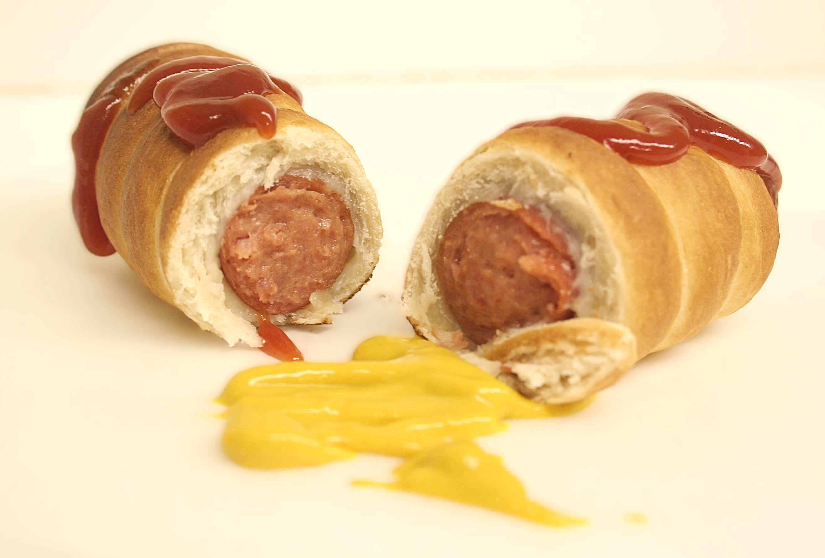 Pretzel 'pig-in-blanket' w/ ketchup & mustard