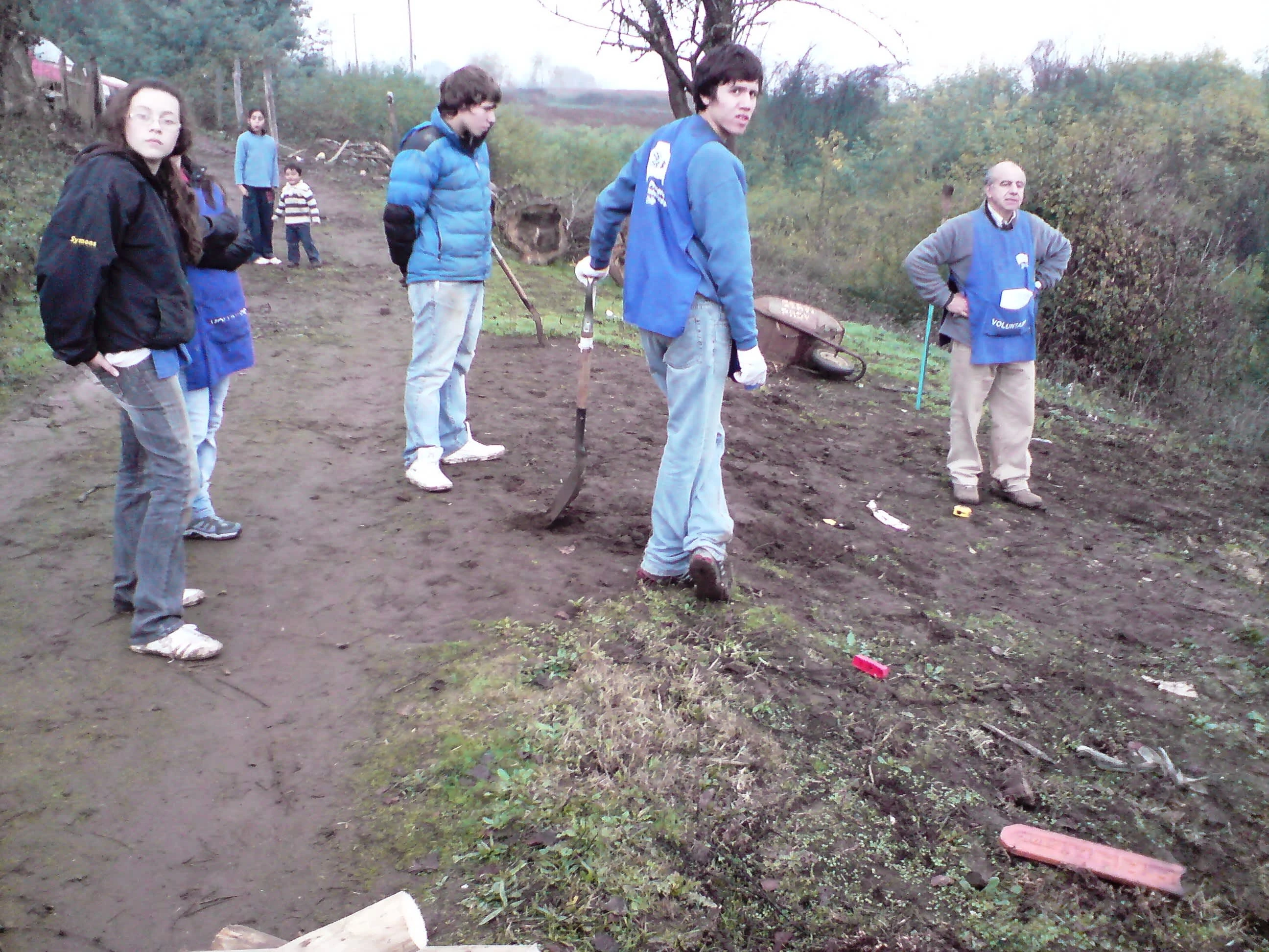 Volunteer team with AFS organizer Roberto Casarejos (right) reviewing the worksite at Los Lomas in the Chilean foothills of the Andes, May 2010. Photo by Ben Angel