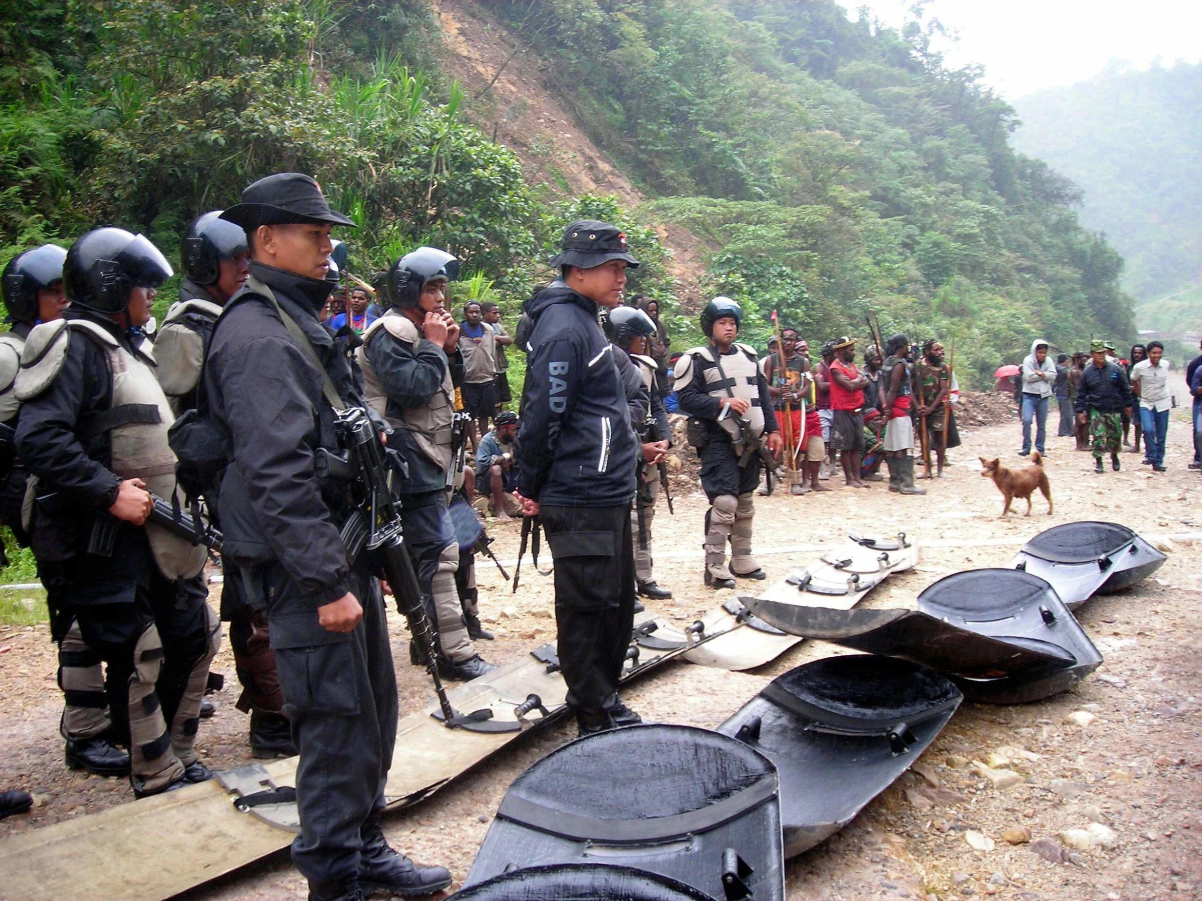 Indonesian police officers on guard in the country’s Papua province. Photo: Reuters/Alamy