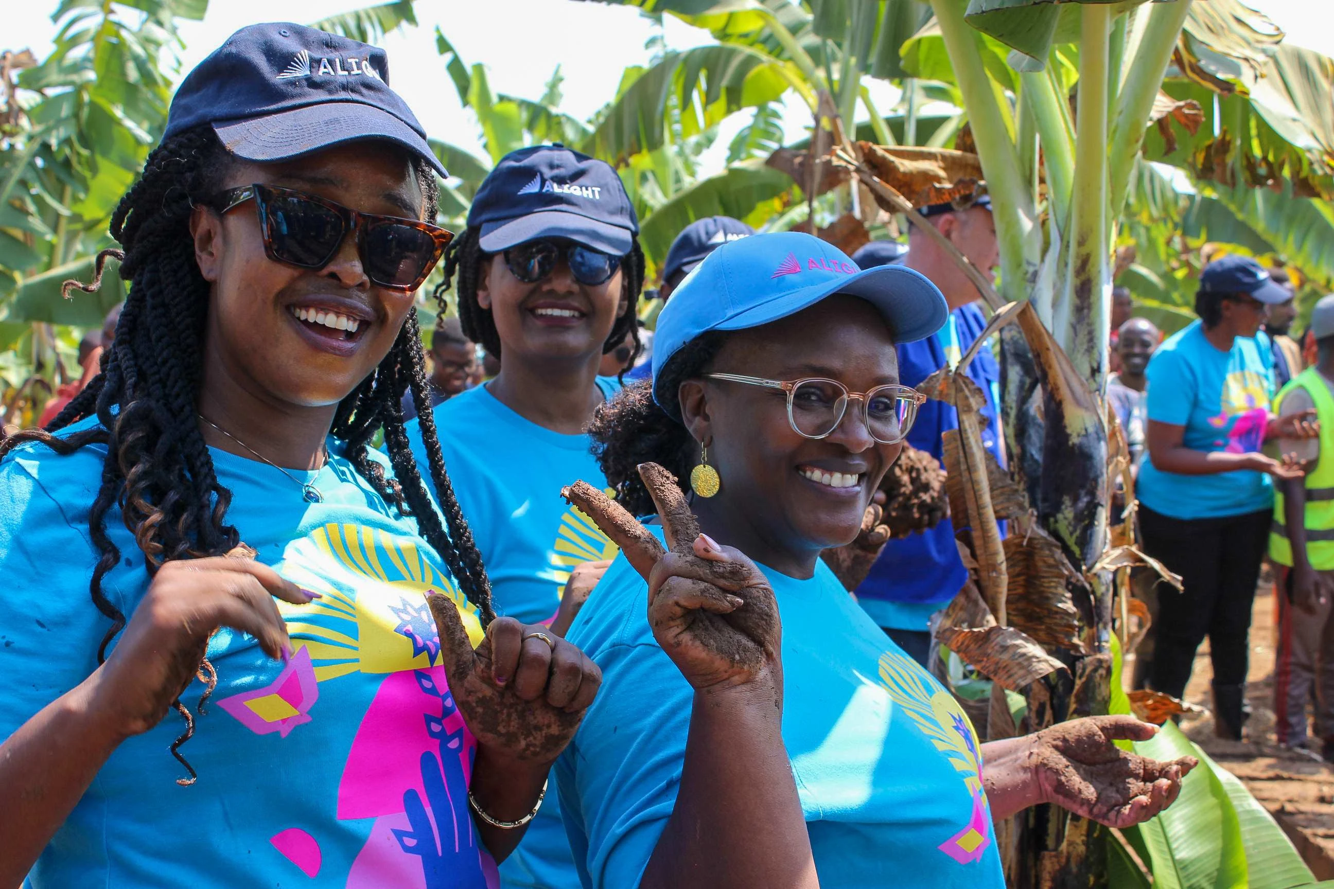 Team Alight Rwanda wearing their custom design t-shirts at the Umuganda event