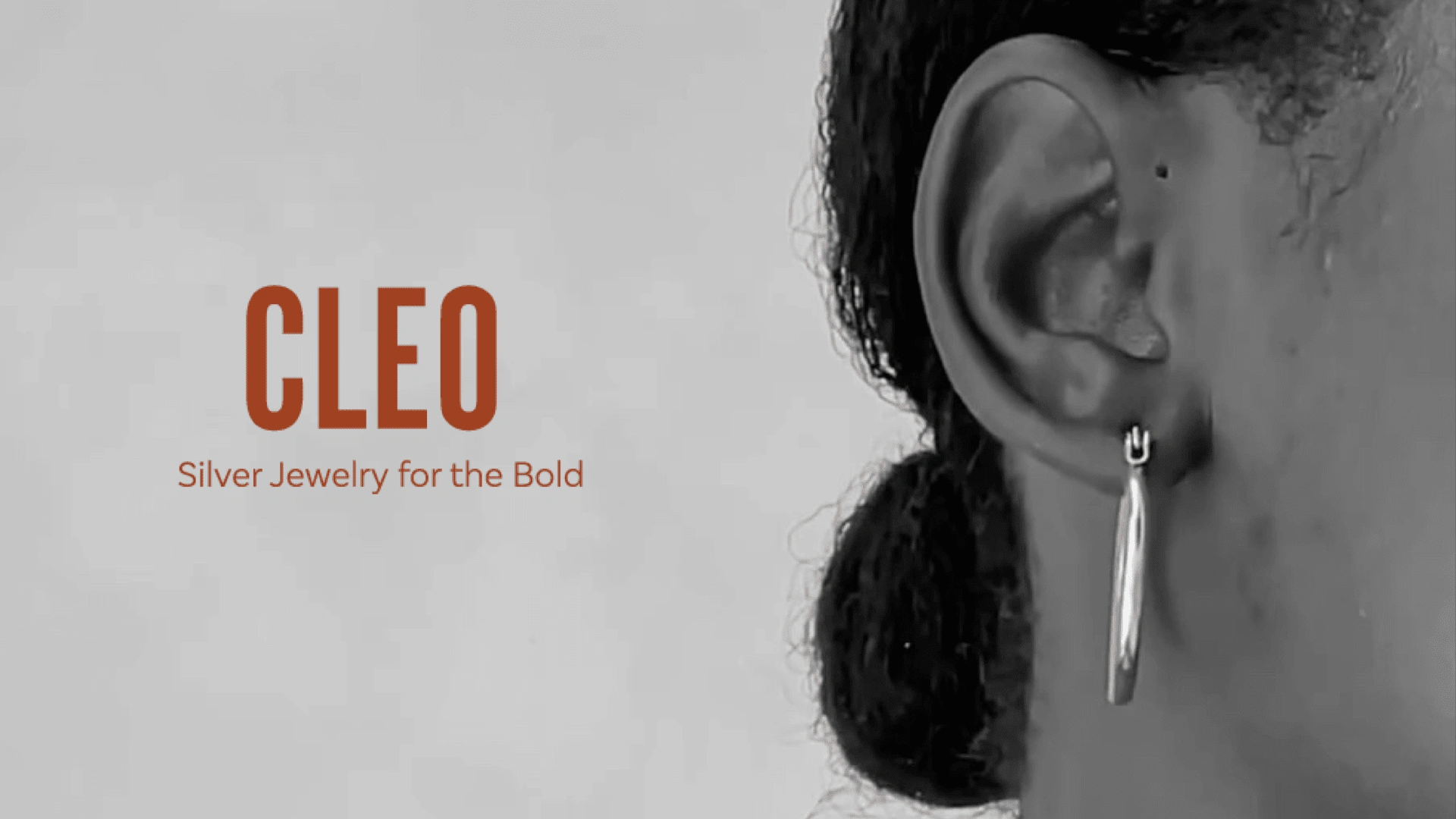 Cleo logo and tagline. (Image with Cleo title and tagline that says "Silver Jewelry for the bold" with a woman's ear with hoop earring.