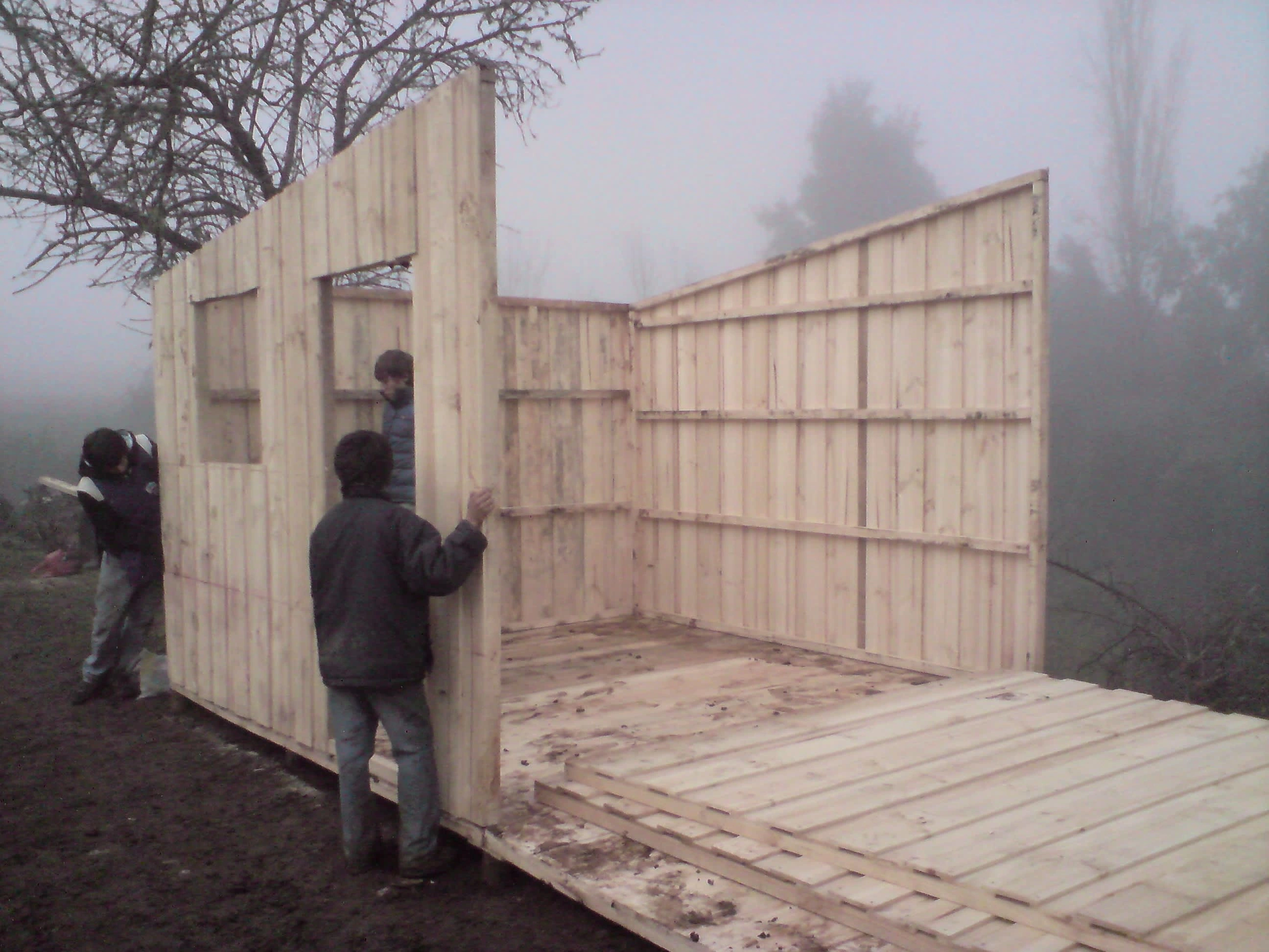 Wall-raising at foggy Los Lomas in May 2010. Photo by Ben Angel.