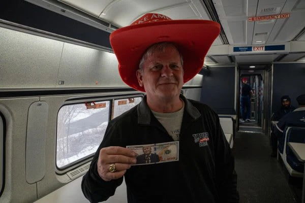 Brian McAcleer, from Michigan, stands in the dining cart of the Floridian Amtrak train heading to Washington D.C. for the inauguration of Donald Trump on Sunday, Jan. 19, 2025. (Addison Annis)