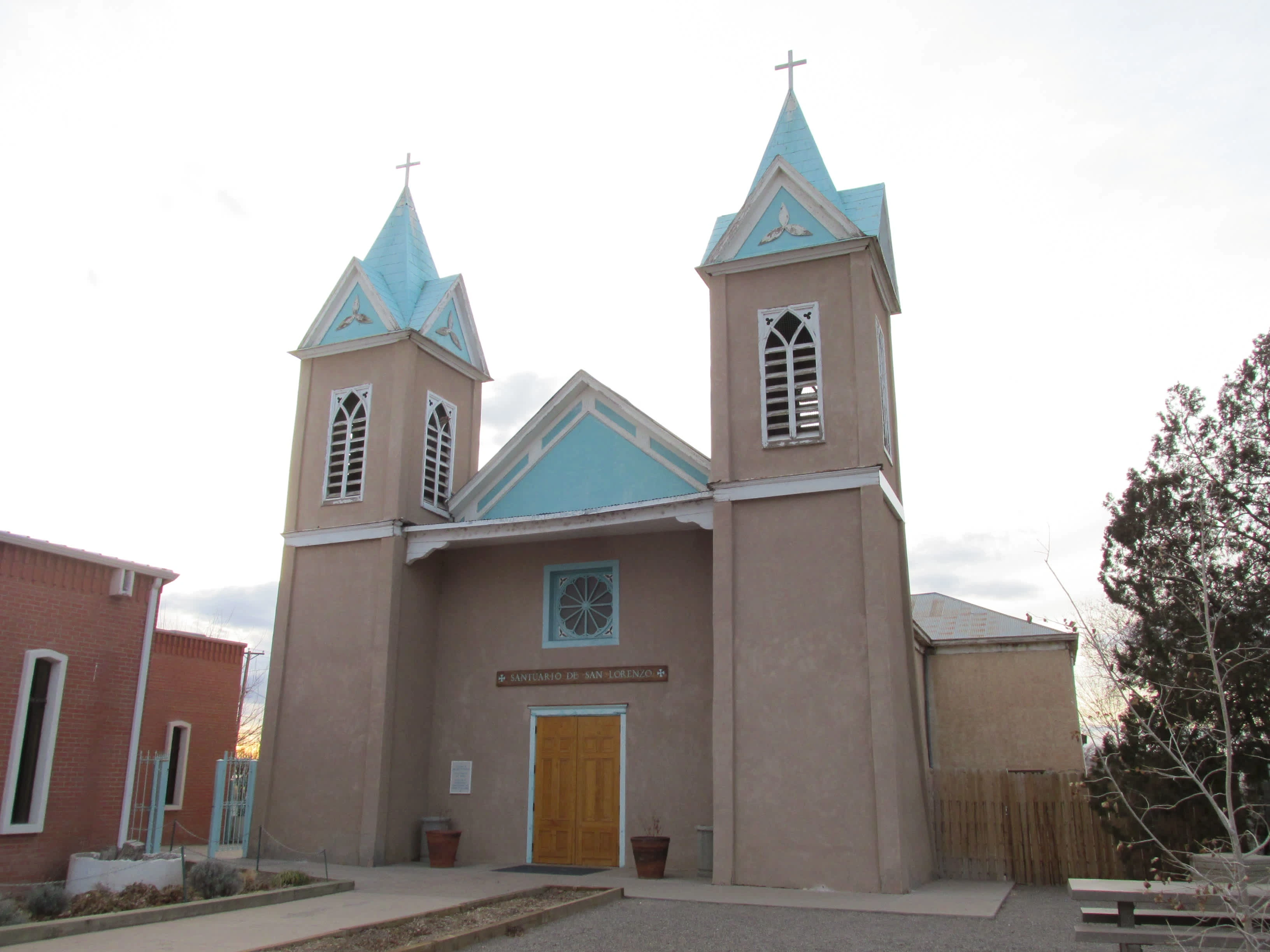 The original Our Lady of Sorrows Church in Bernalillo was abandoned in 1971 in favor of a new Our Lady of Sorrows Church that was built adjacent to it. The old church was restored after 1977 as the Santuario de San Lorenzo. Photo by John Phelan via Wikimedia Commons.