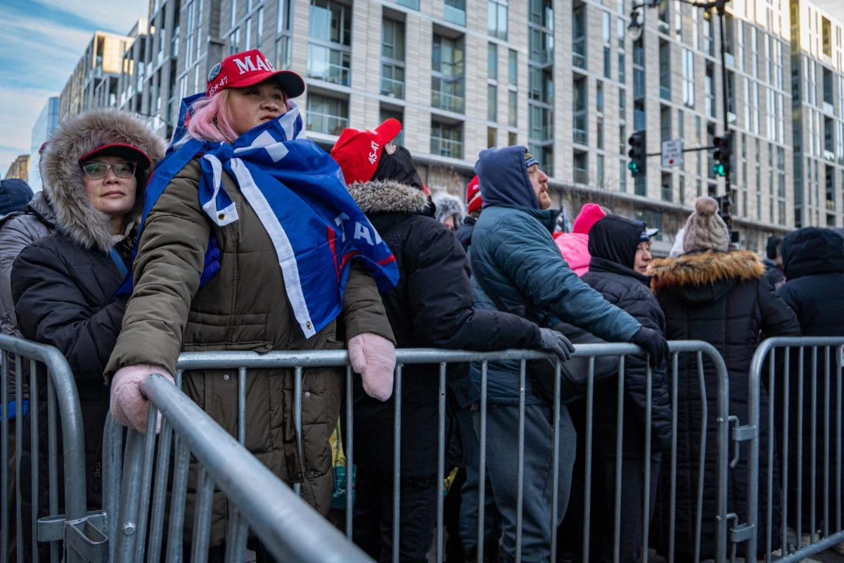 Trump supporters wait in line outside of the Capital One Arena in Washington D.C. as people file in for an inauguration watch party on Monday, Jan. 20, 2025. [Addison Annis]

