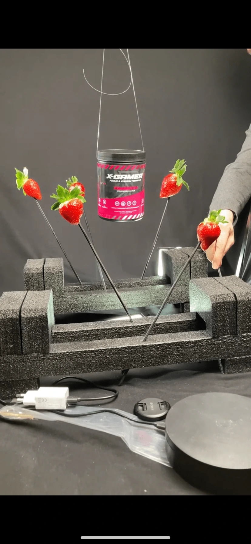 Using strawberries and fishing line to create a cool looking shot 