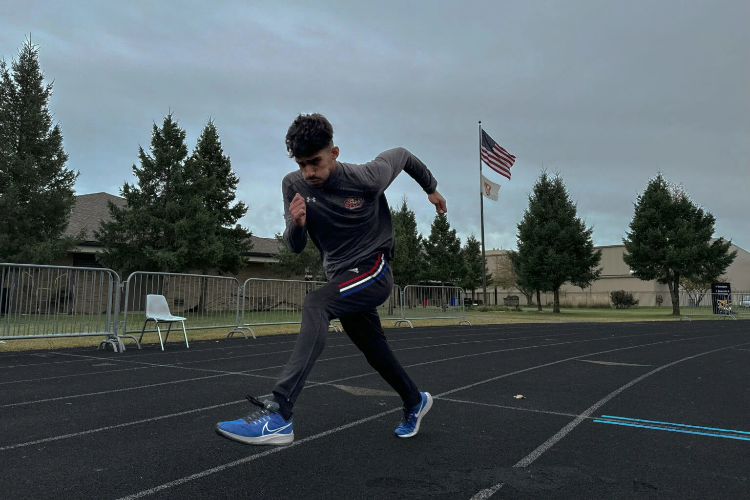 Karam Jaber, a senior student athlete and criminal justice major, does multiple rounds of sprints before his cool down for his individual training at St. Xavier University in Chicago, Illinois on Friday Sept. 27, 2024. Photo by Maya Liquigan