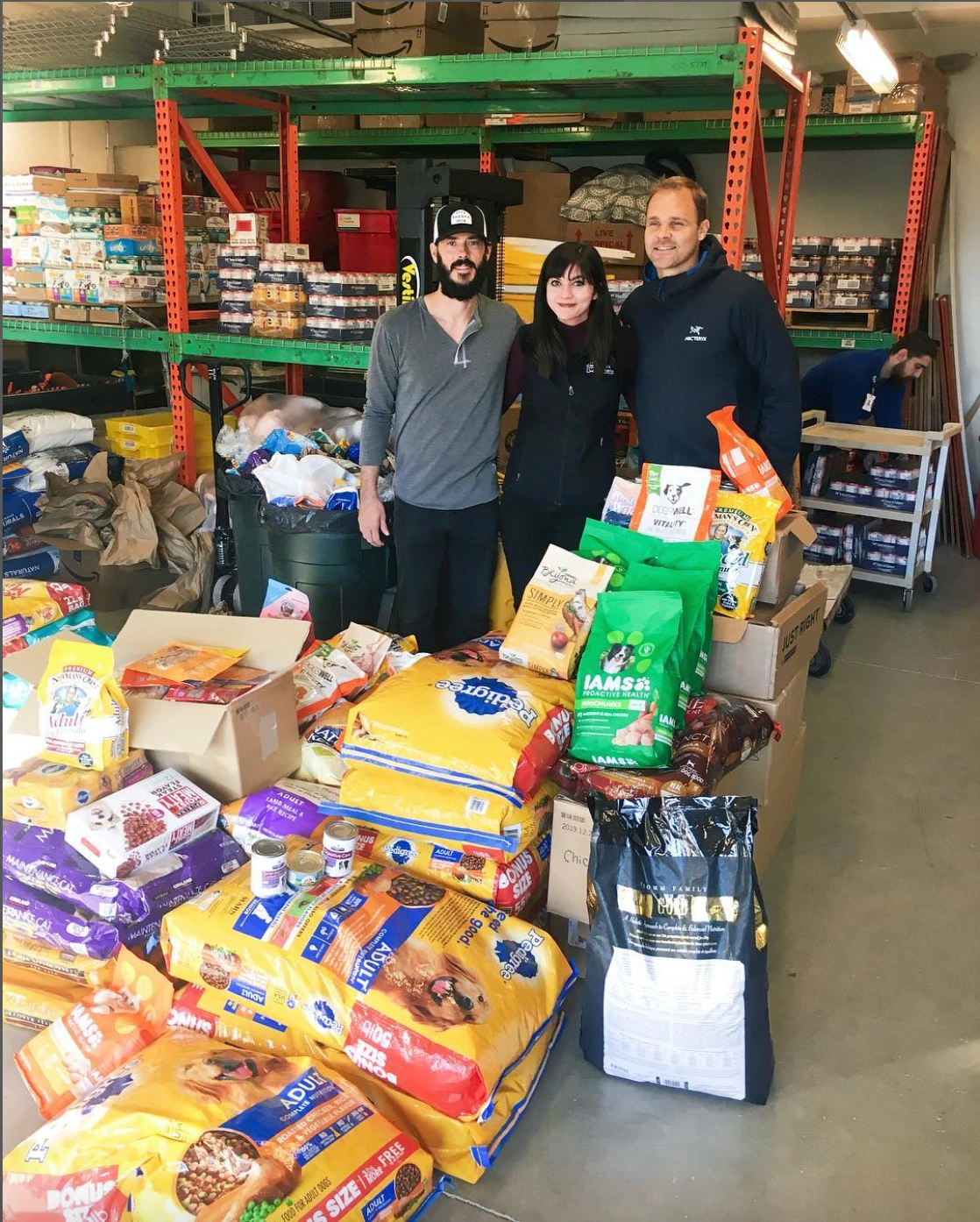 Here I am at Seattle Humane during a food donations delivery for the shelter's Pet Food Bank. To my left and right are professional soccer players from the Seattle Sounders (Brad Evans and Chad Marshall) who joined for this drop-off.