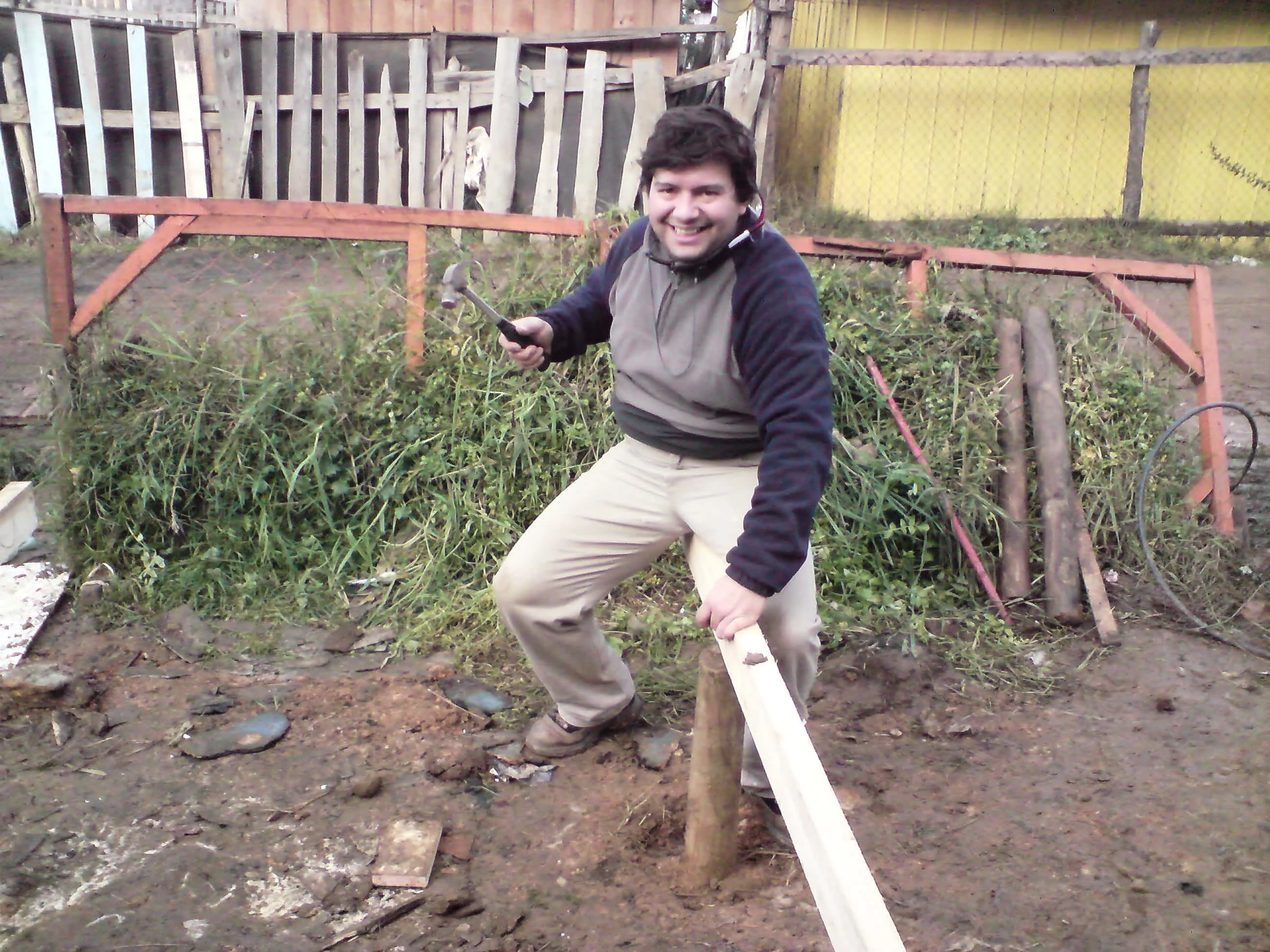 Manuel nailing in a floor beam for a 15-pile foundation at Lota, June 2010. Photo by Ben Angel, June 2010.