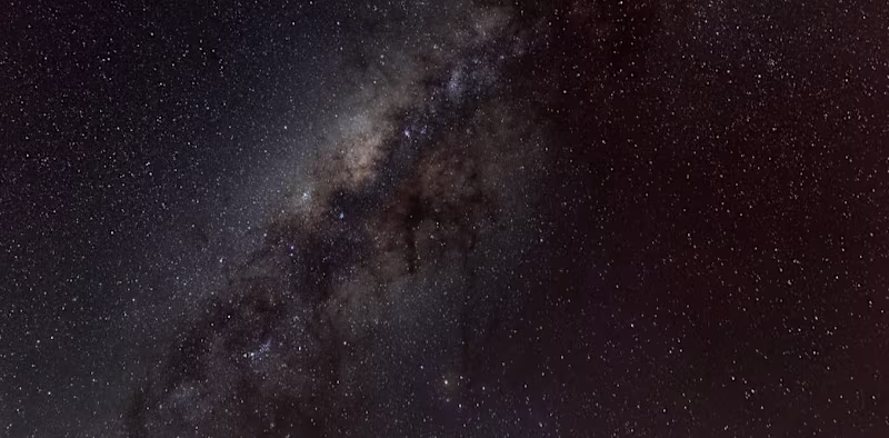 Cover image for Why is space so dark even though the universe is filled with st…