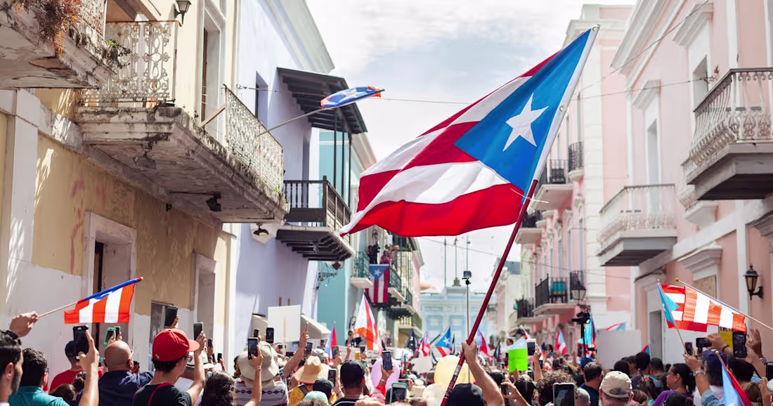 Cover image for 5 Protestors In San Juan Share Why They Wear The Puerto Rican F…