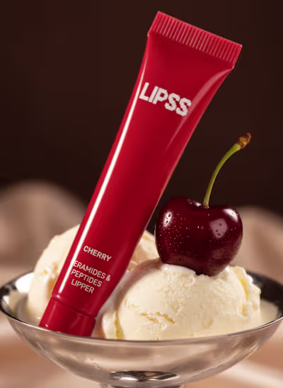 LIPSS Cherry Balm A glossy macro editorial where the cherry ...