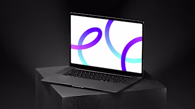A sleek mockup of a dark laptop featuring a minimal gradient...